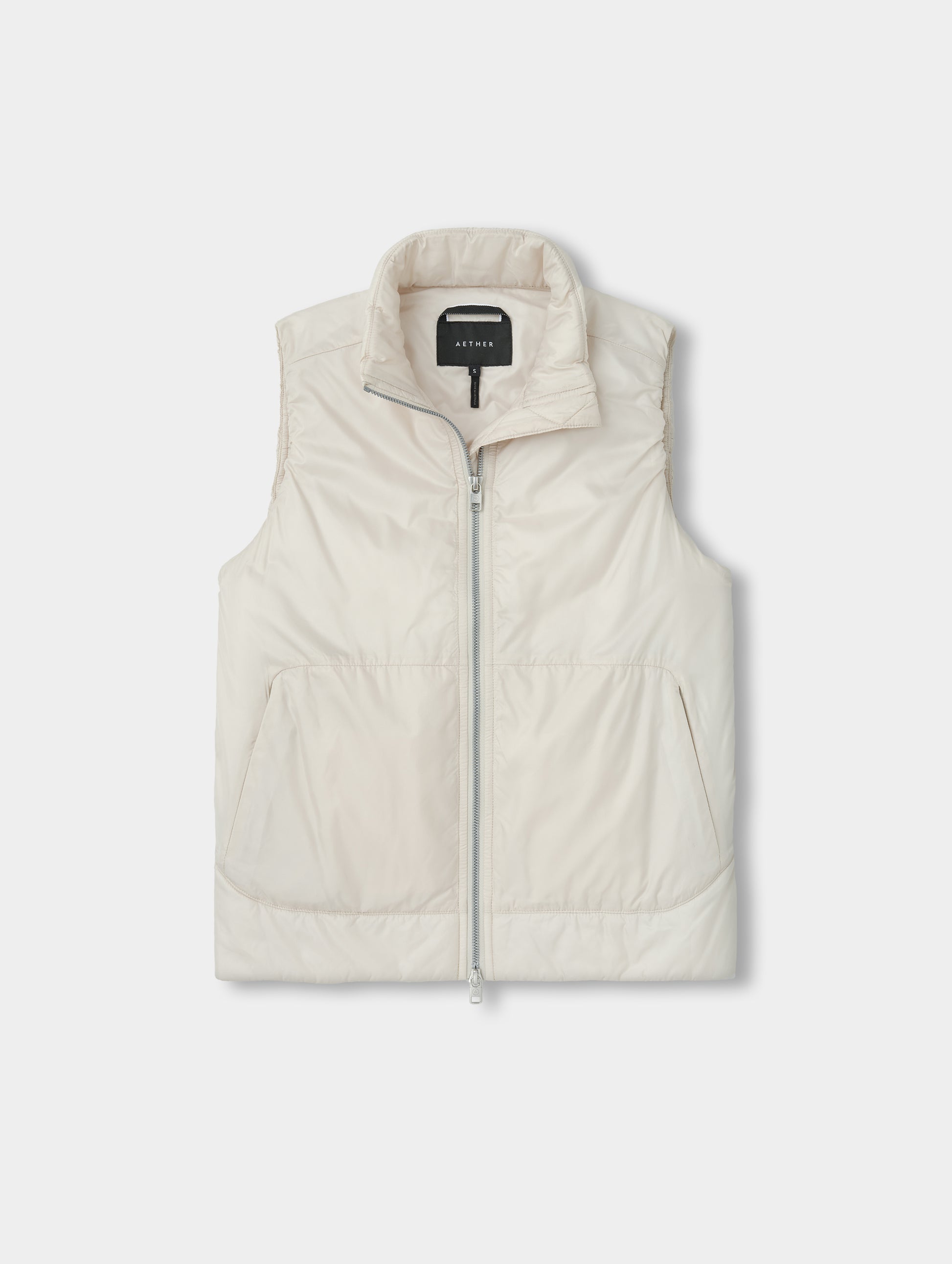 Flat lay view of the Celeste Eco Insulated Vest in Bone from AETHER Apparel.