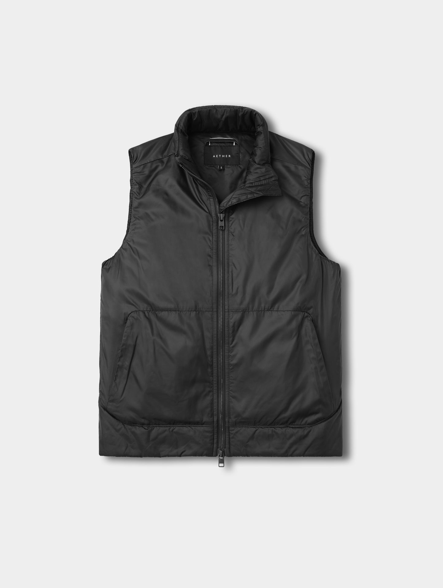 Flat lay view of the Celeste Eco Insulated Vest in Onyx Black from AETHER Apparel.