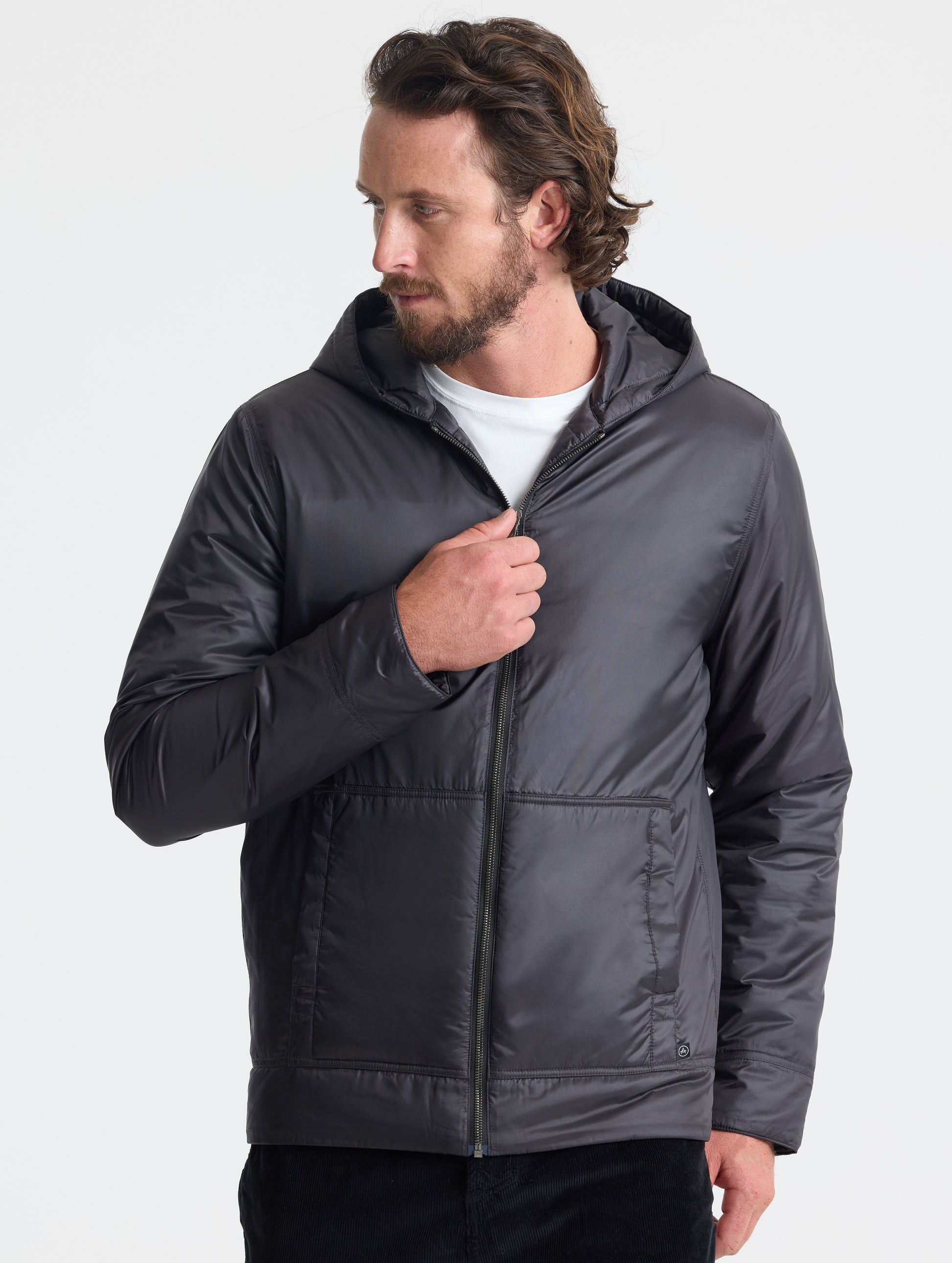Front view of man wearing Eco Space Hoodie in Onyx Black from AETHER Apparel.