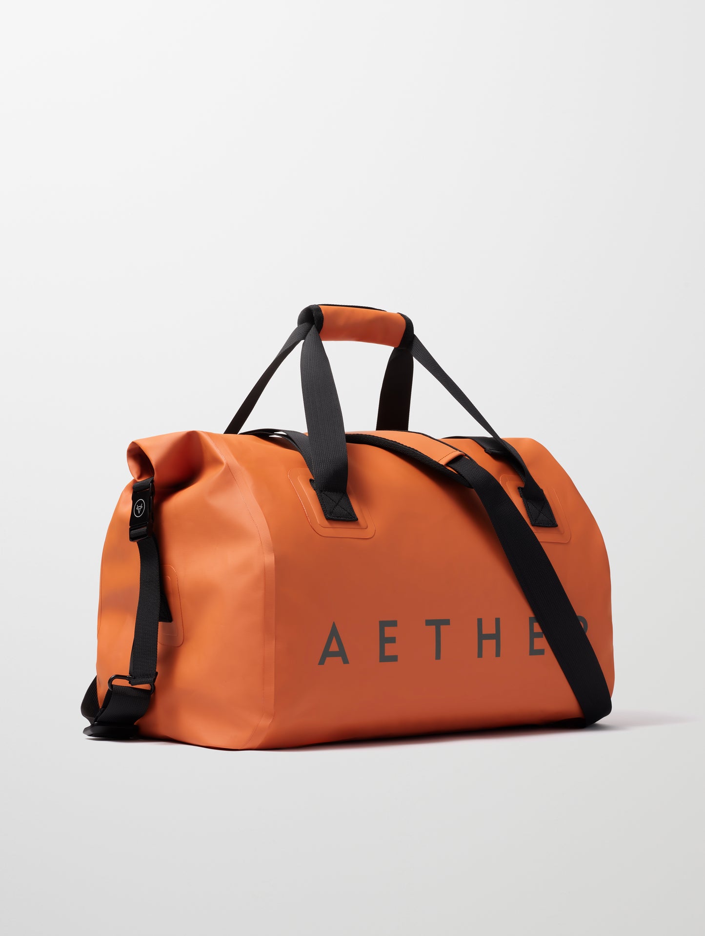 Front angled view of Excursion Duffle Bag 45L in Autumn Orange from AETHER Apparel.