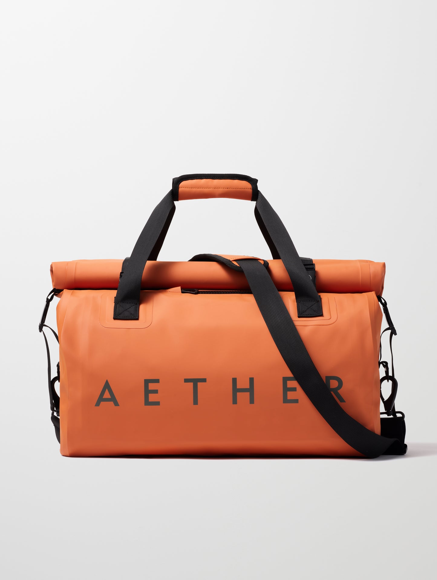 Front view of Excursion Duffle Bag 45L in Autumn Orange from AETHER Apparel.