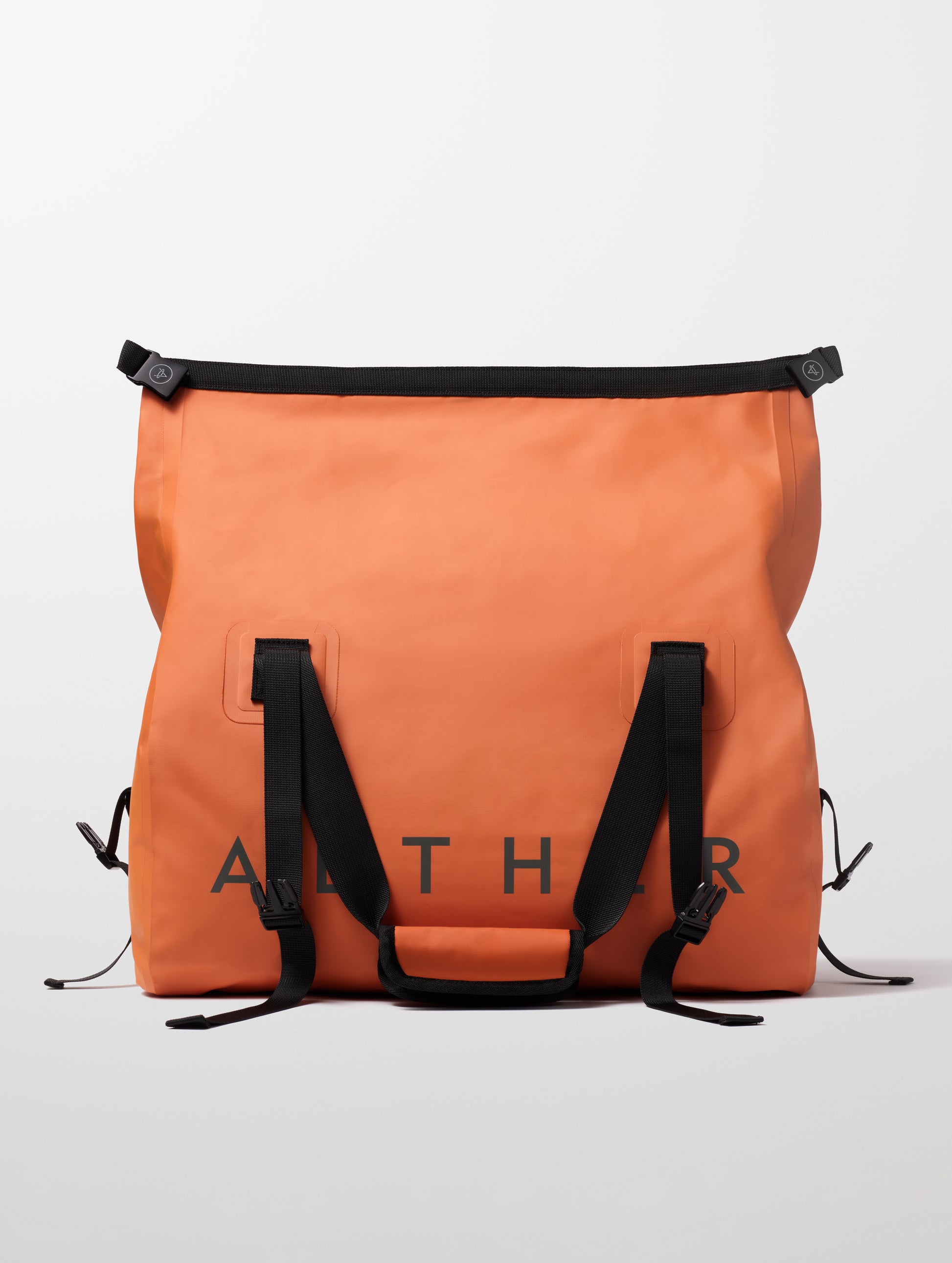 Rear view of unrolled Excursion Duffle Bag 45L in Autumn Orange from AETHER Apparel.