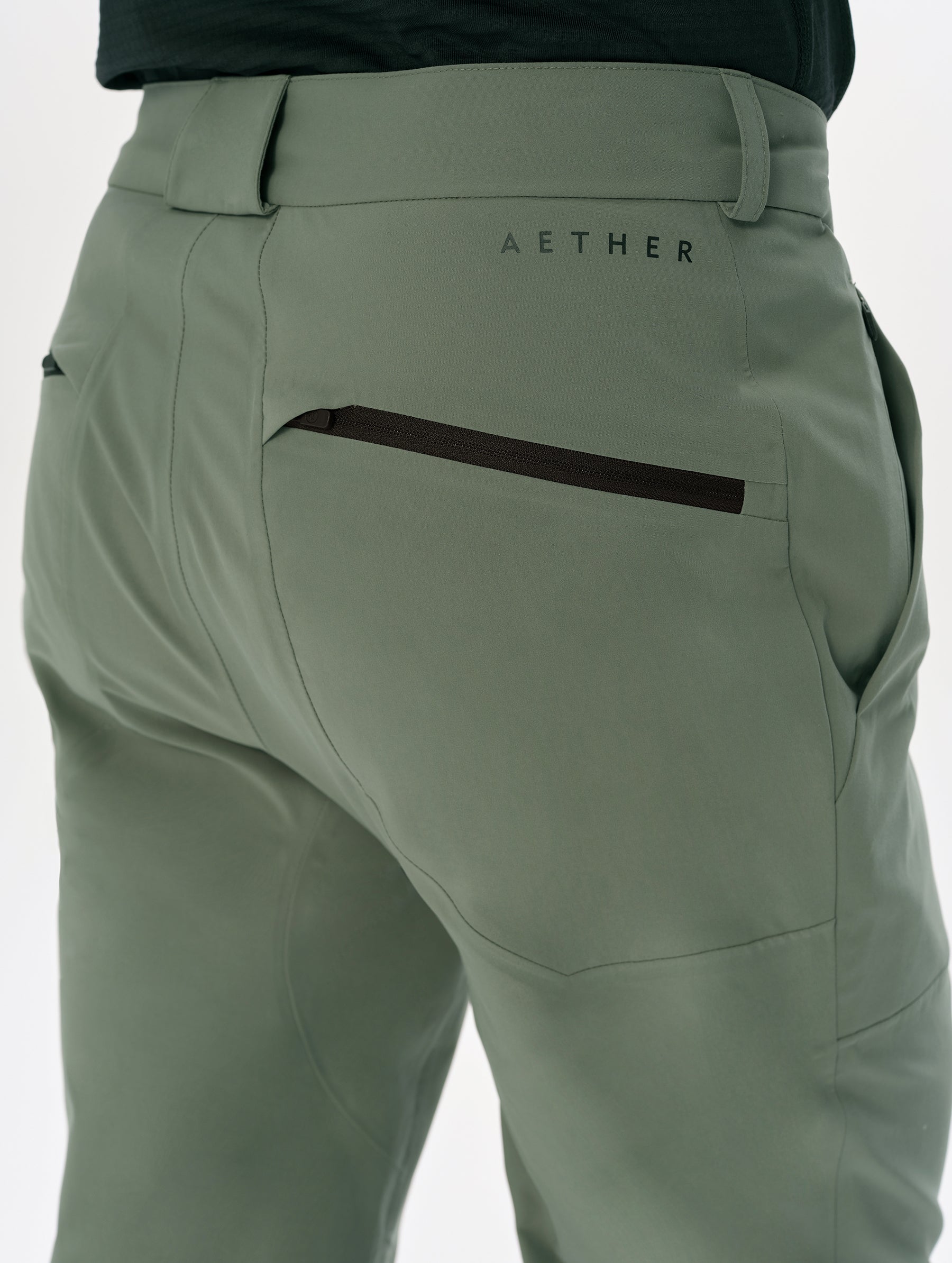 Closeup detailed view of the back pocket on the Frontier Pant in Gunmetal from AETHER Apparel.