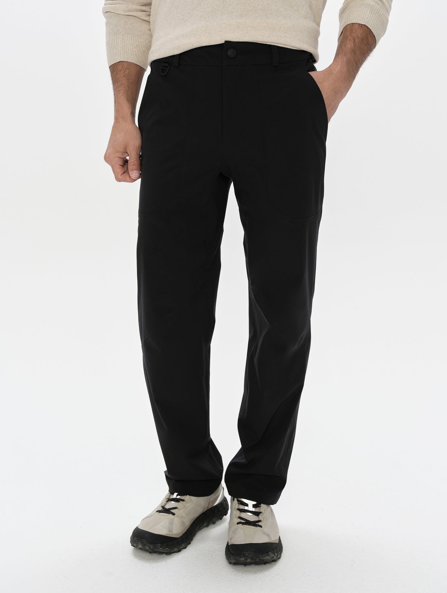 Front, lower-body view of man wearing the Frontier Pant in Onyx Black from AETHER Apparel.