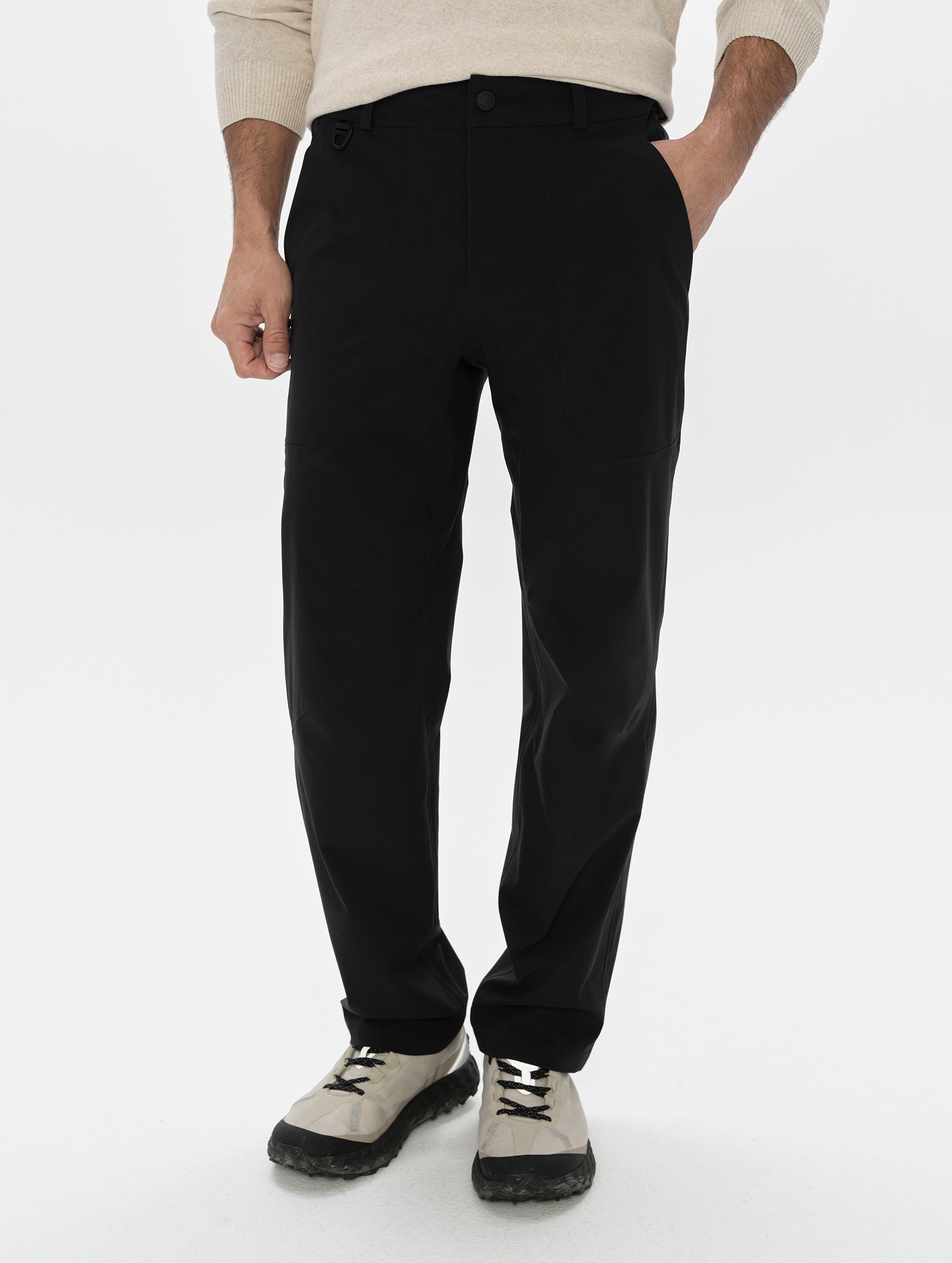 Front, lower-body view of man wearing the Frontier Pant in Total Eclipse dark blue from AETHER Apparel.
