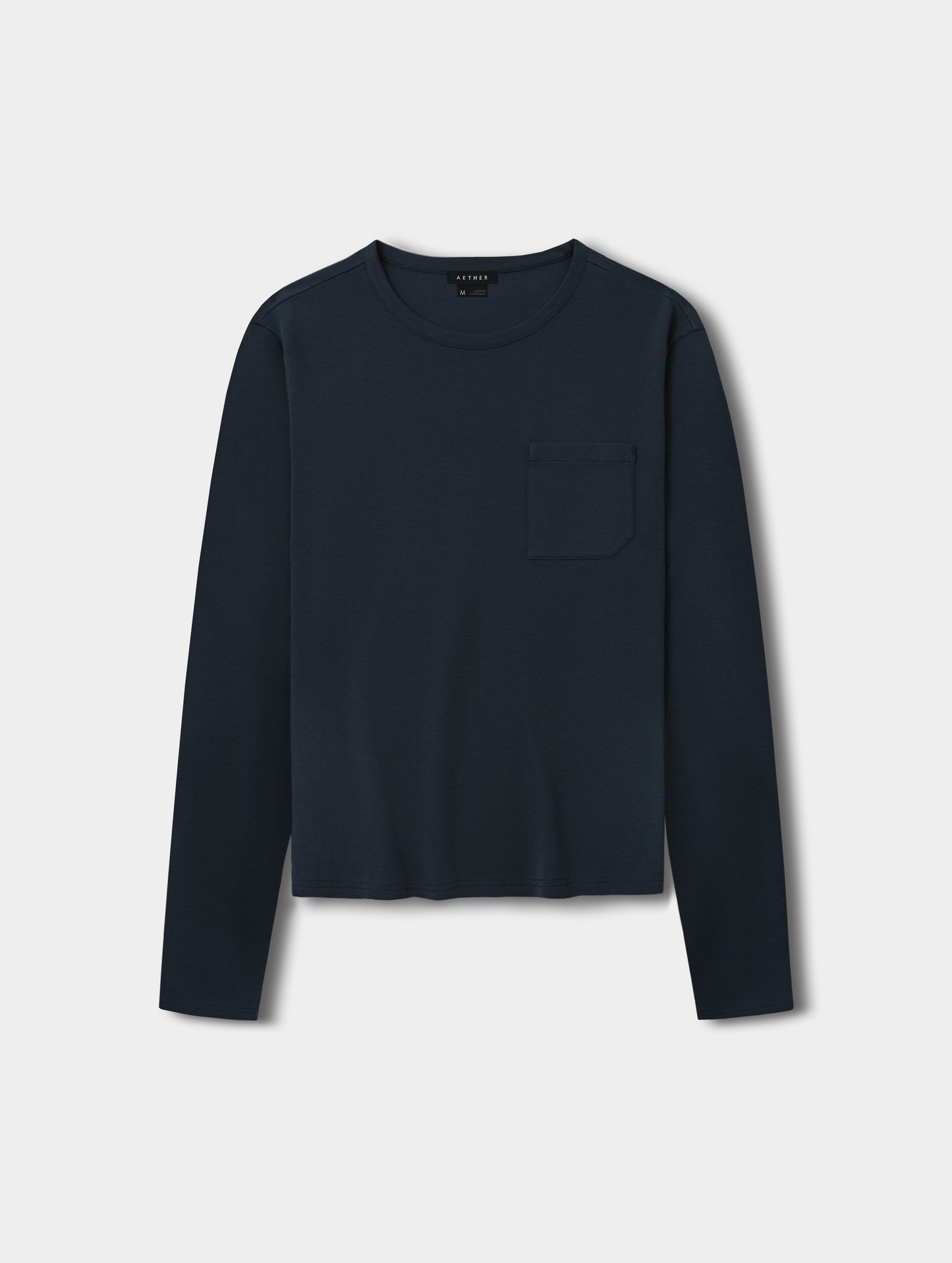 Flat lay view of Harlow Premium Long-Sleeve Tee in Total Eclipse from AETHER Apparel.