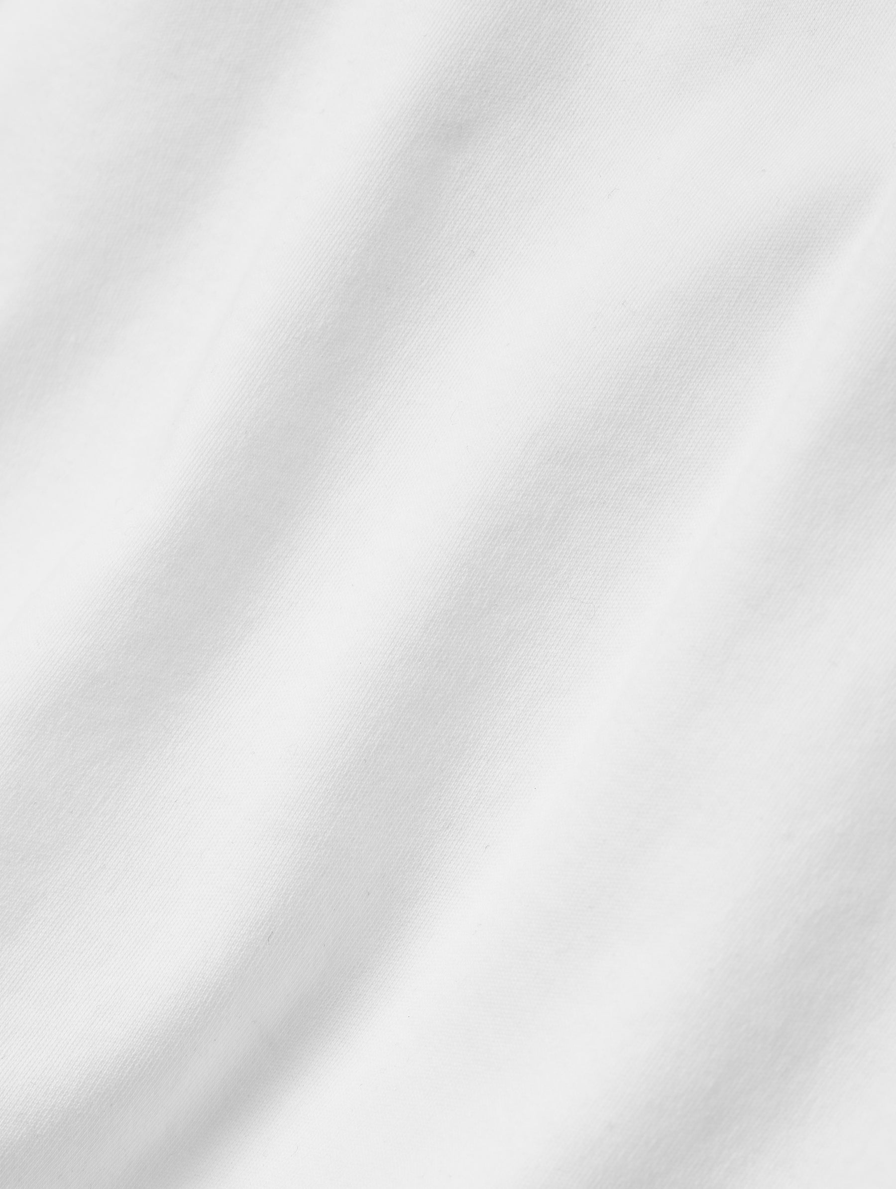 Closeup detailed view of the fabric of the Harlow Premium Long-Sleeve Tee in White from AETHER Apparel.