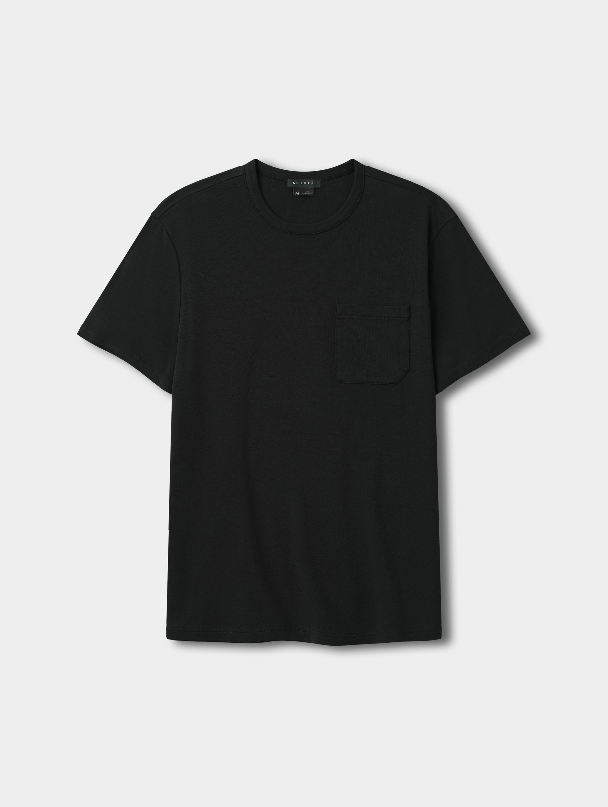 Flat lay view of the Harlow Premium Tee in Onyx Black from AETHER Apparel.