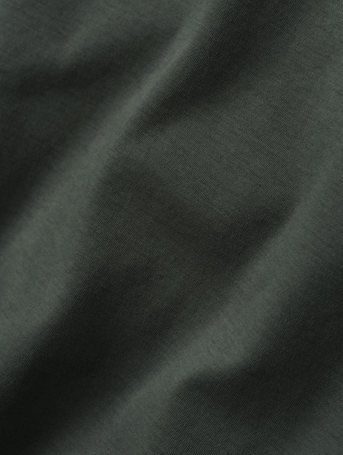 Closeup detailed view of the fabric on the Harlow Premium Tee in Saville Green from AETHER Apparel.