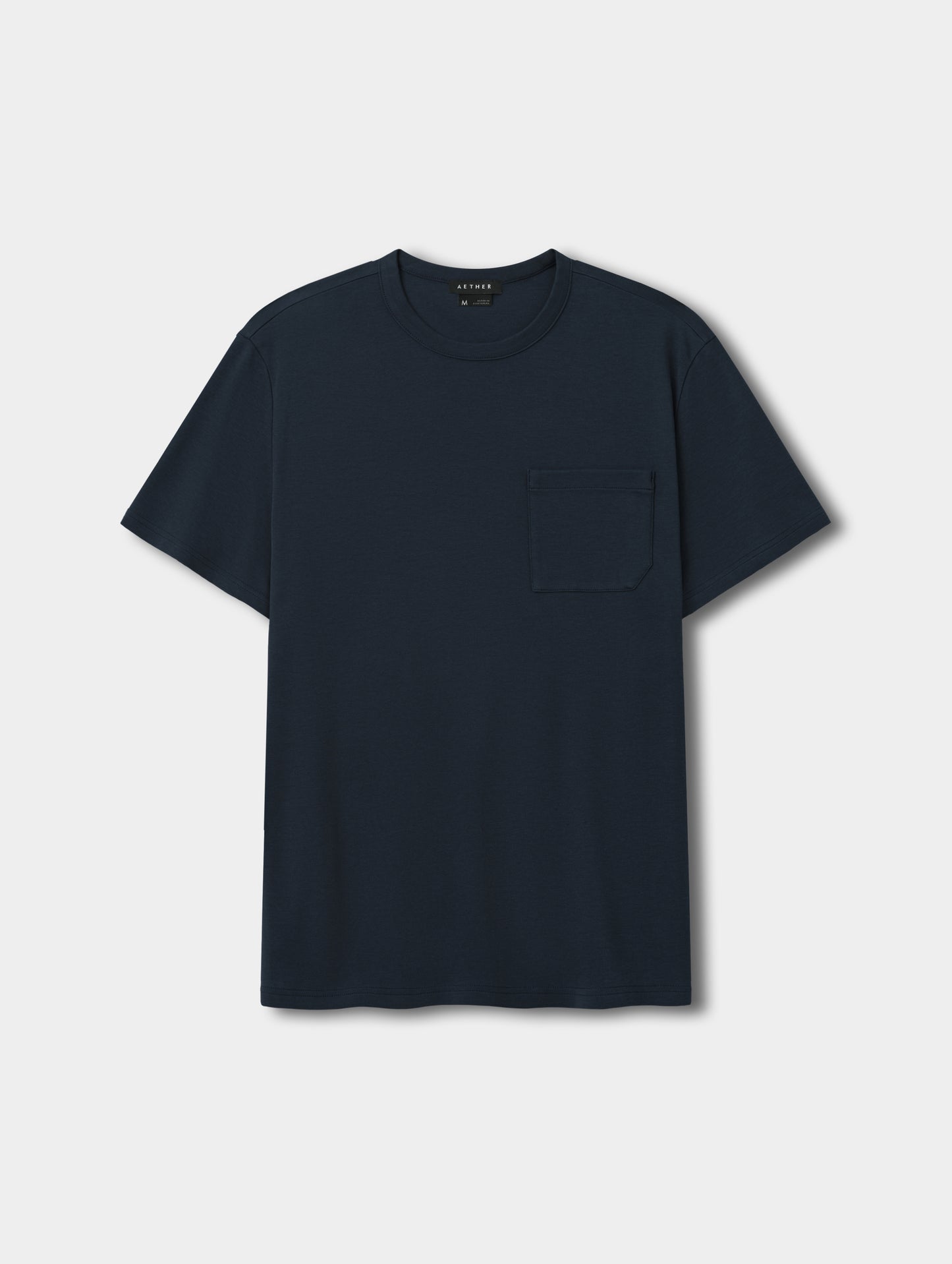 Flat lay view of Harlow Premium Tee in Total Eclipse from AETHER Apparel.