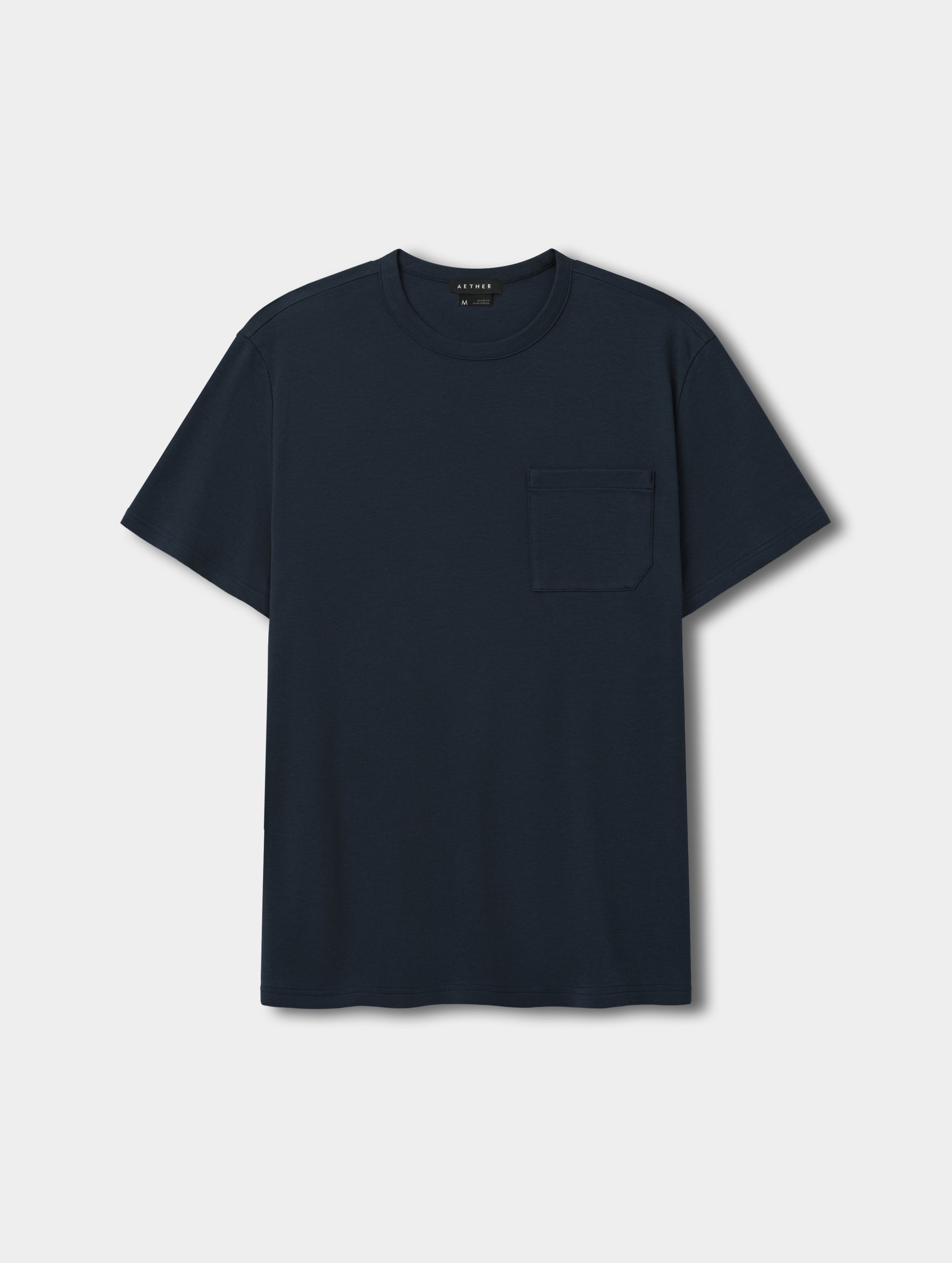 Flat lay view of Harlow Premium Tee in Total Eclipse from AETHER Apparel.