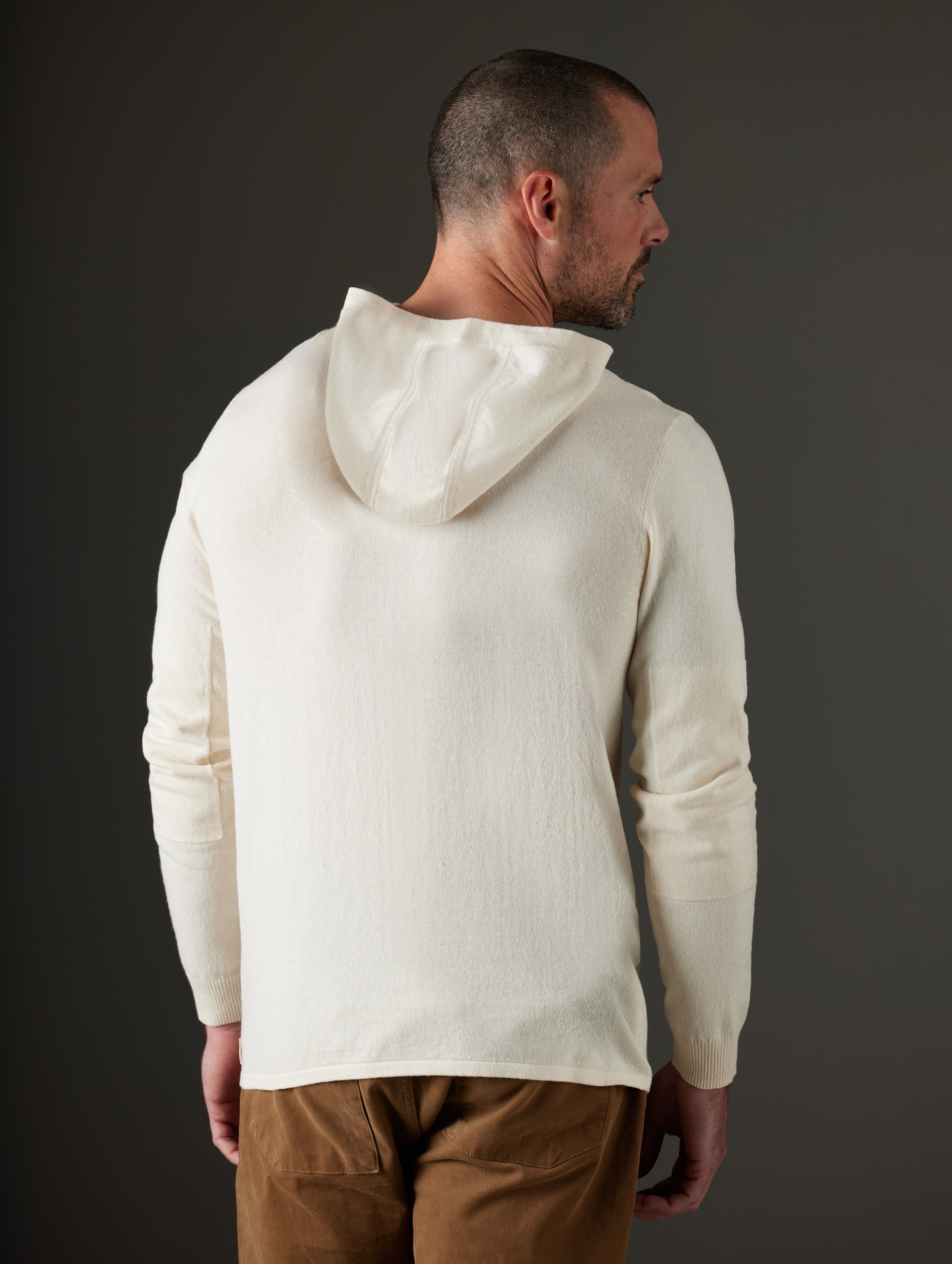 Man wearing beige hooded sweater from AETHER Apparel