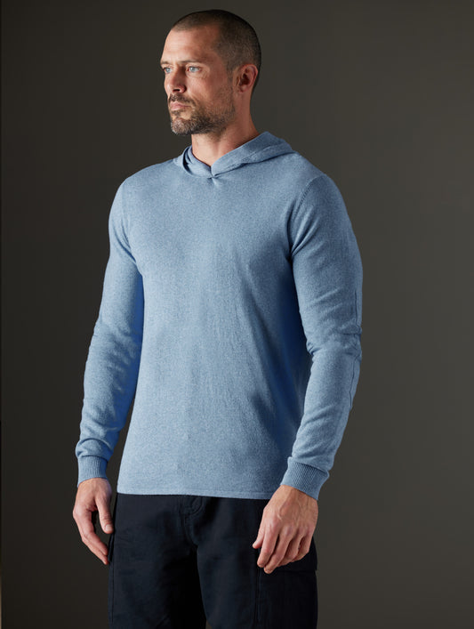 Man wearing blue hooded sweater from AETHER Apparel