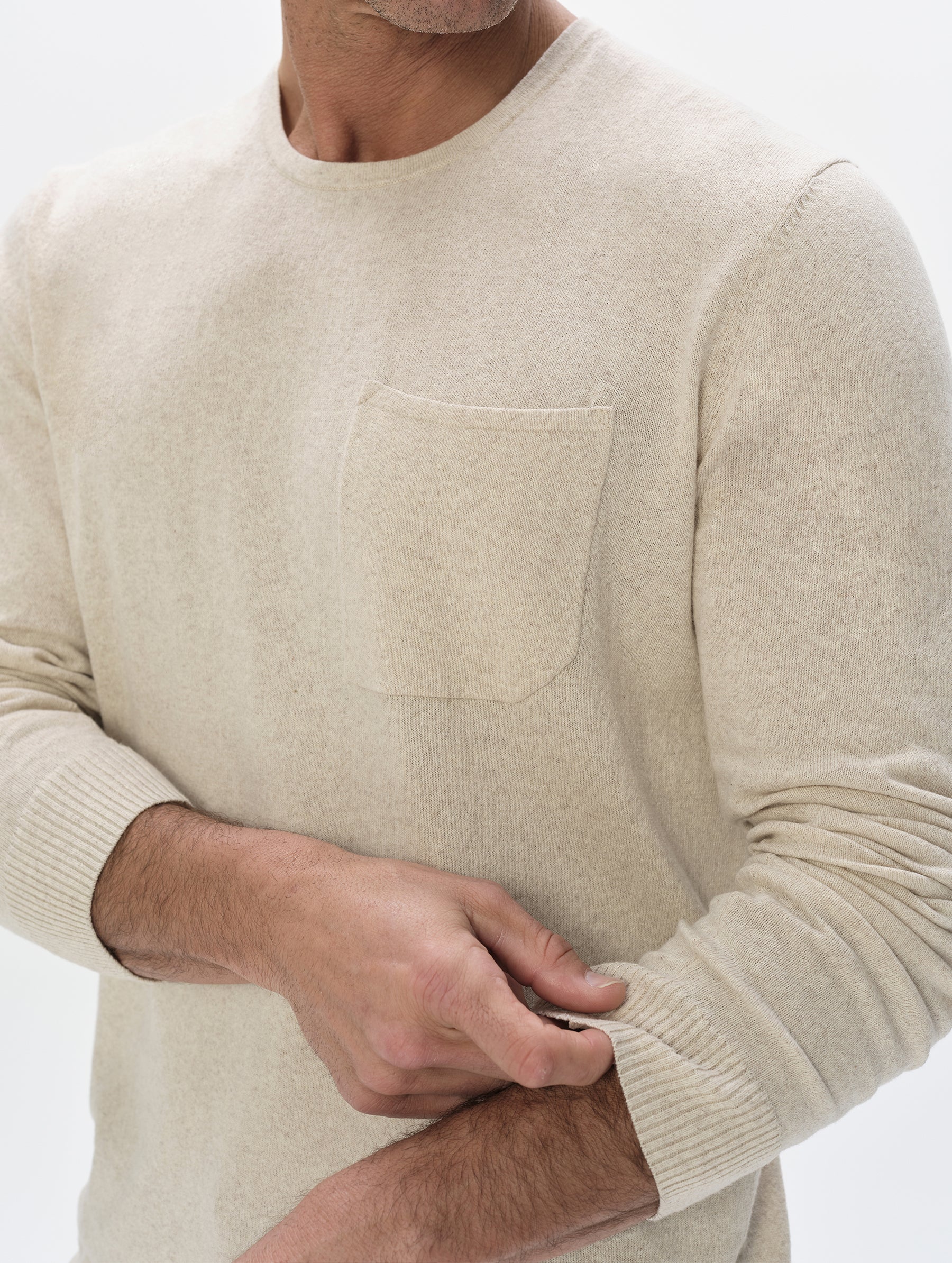 Closeup detailed view of the men's Aero Crewneck Sweater 2.0 in Lino Tan from AETHER Apparel.