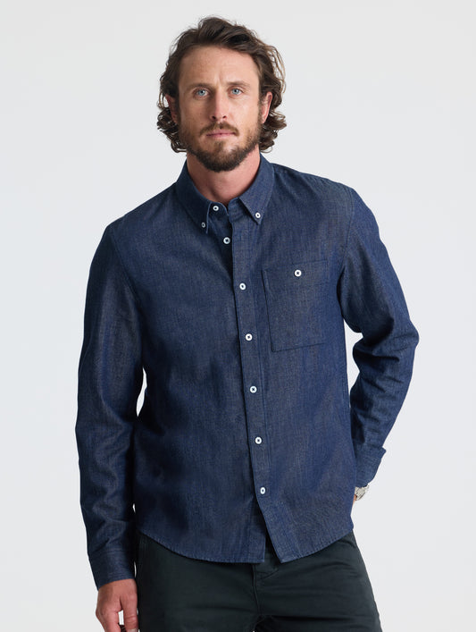 Front view of man wearing Alder Chambray Button-Down in Dark Blue from AETHER Apparel.