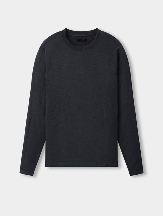 Flat lay of the men’s Alpine Seamless Base Layer Crew in Graphite from AETHER Apparel, with crew neckline and raglan sleeves.