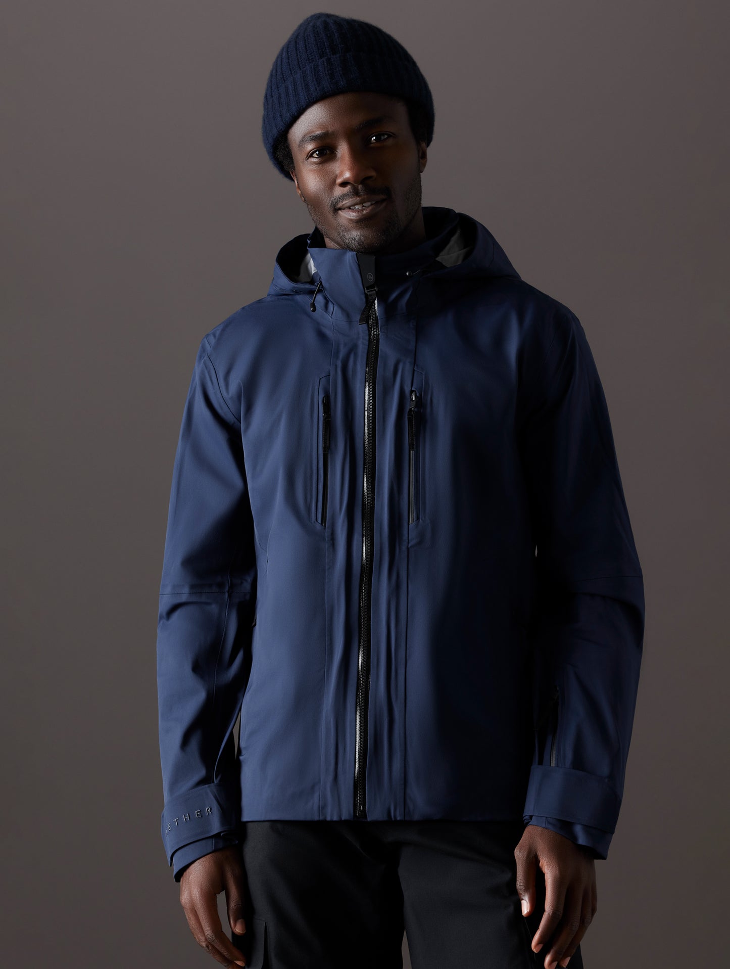 man wearing blue snow shell from AETHER Apparel