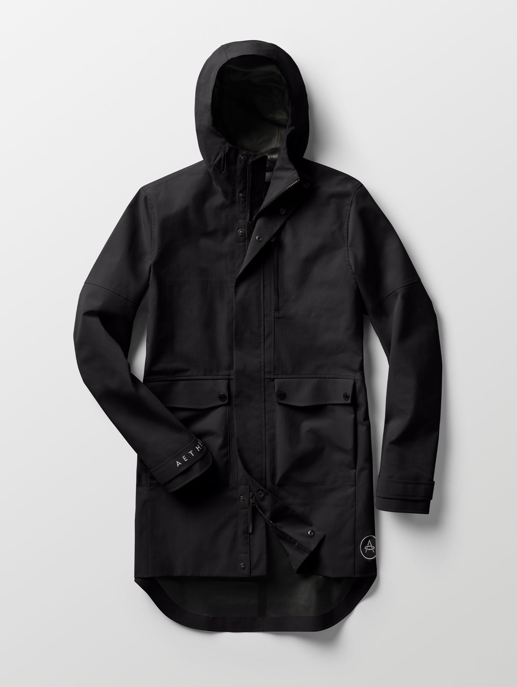 Studio flat lay of the Anders Rain Jacket in Onyx Black from AETHER Apparel.
