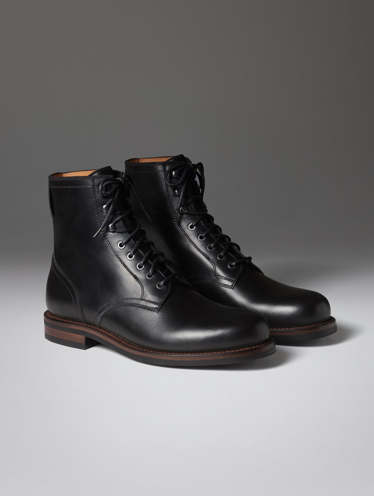 Front angled view of the Avenue Boot in Onyx Black with black laces from AETHER Apparel.