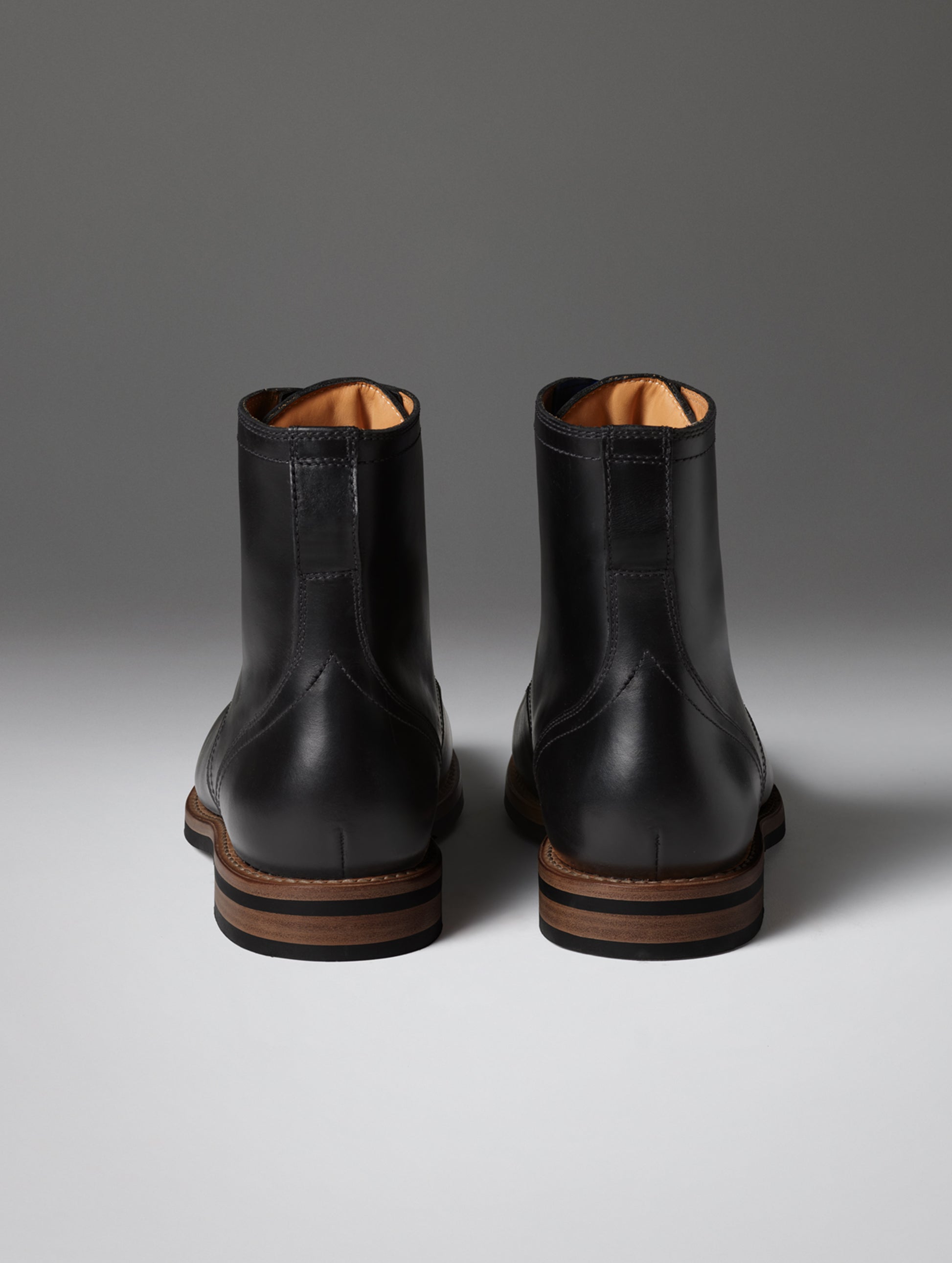 Rear view of the Avenue Boot in Onyx Black from AETHER Apparel.
