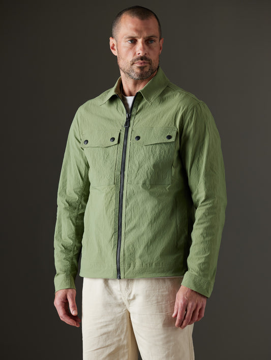 Man wearing green jacket from AETHER Apparel