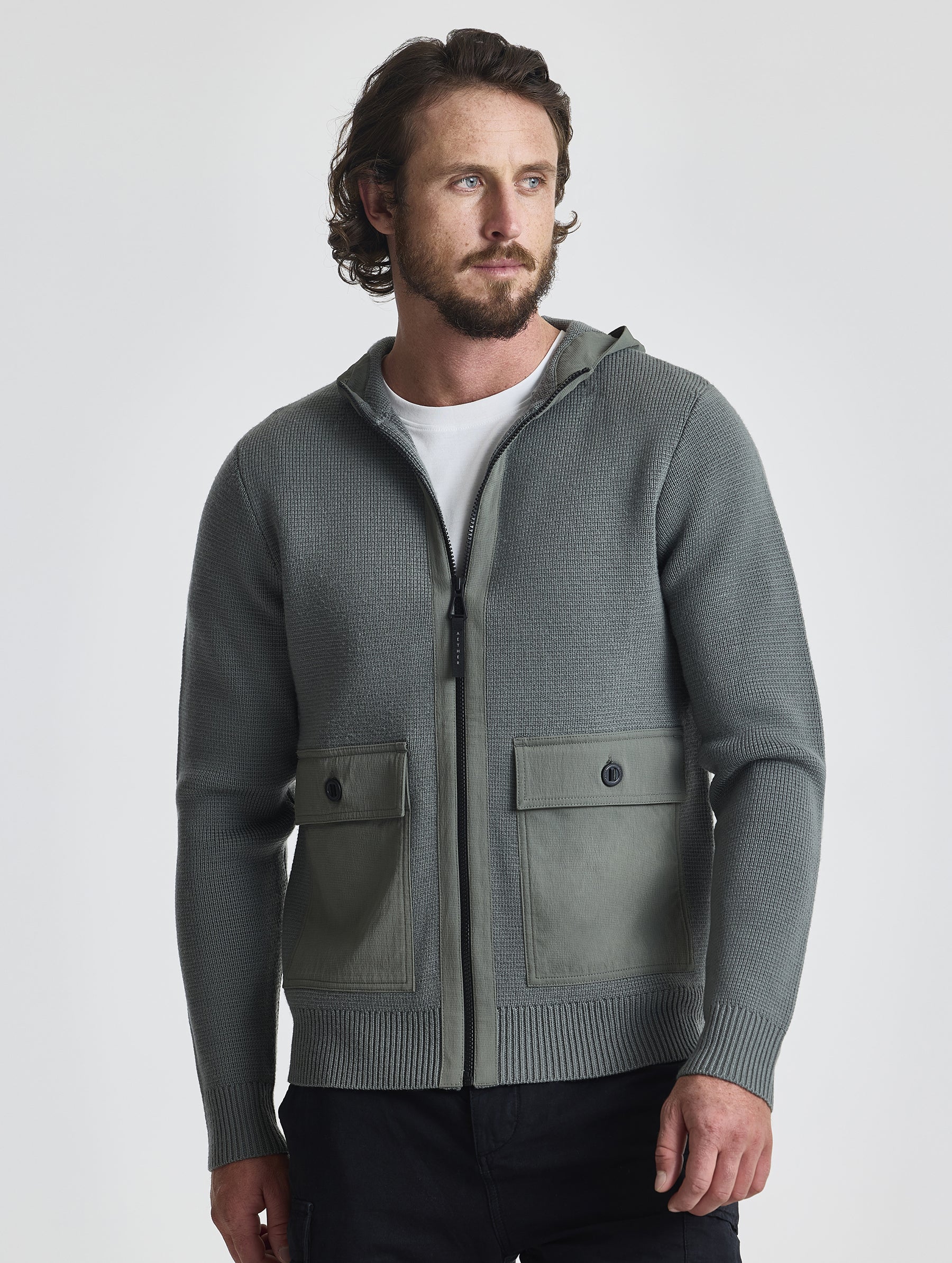Front view of man wearing Benson Full-Zip Sweater in Gunmetal grey from AETHER Apparel.