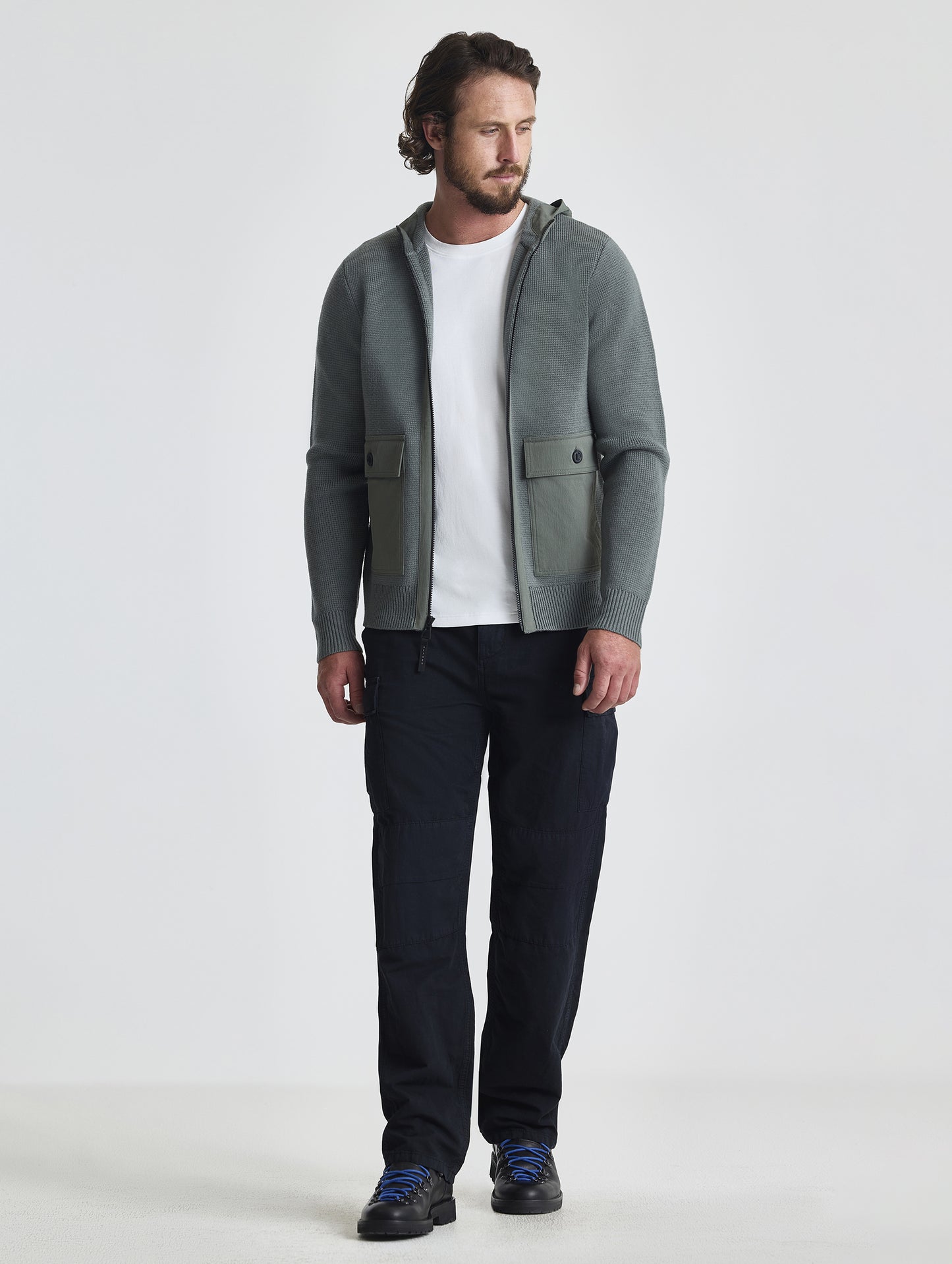 Full body view of man wearing Benson Full-Zip Sweater in Gunmetal grey from AETHER Apparel.