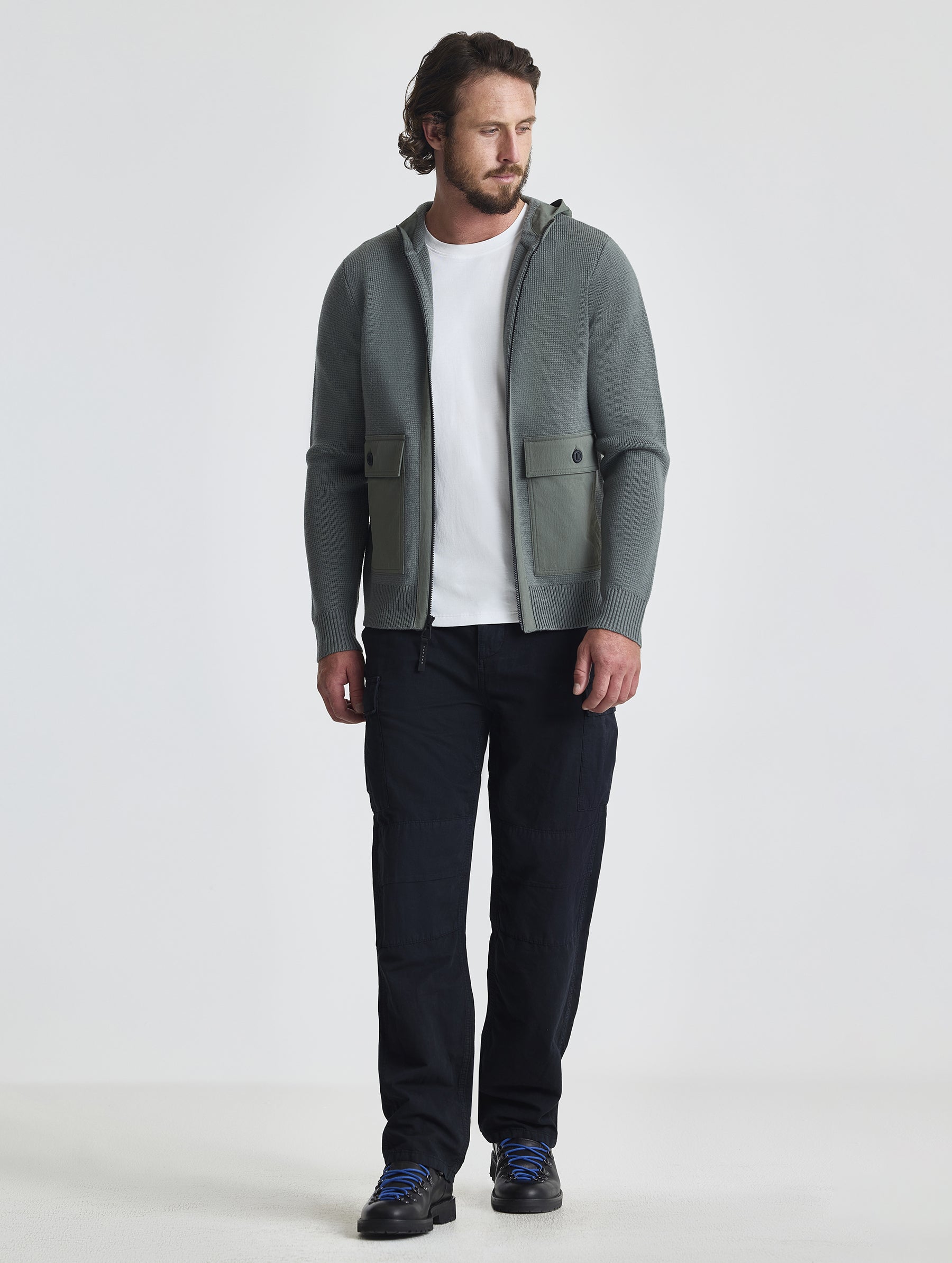 Full body view of man wearing Benson Full-Zip Sweater in Gunmetal grey from AETHER Apparel.