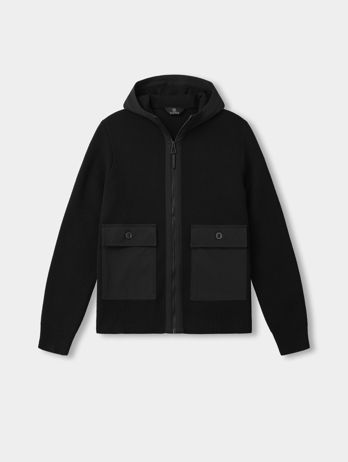 Flat lay of the Benson Full-Zip Sweater in Onyx Black from AETHER Apparel.