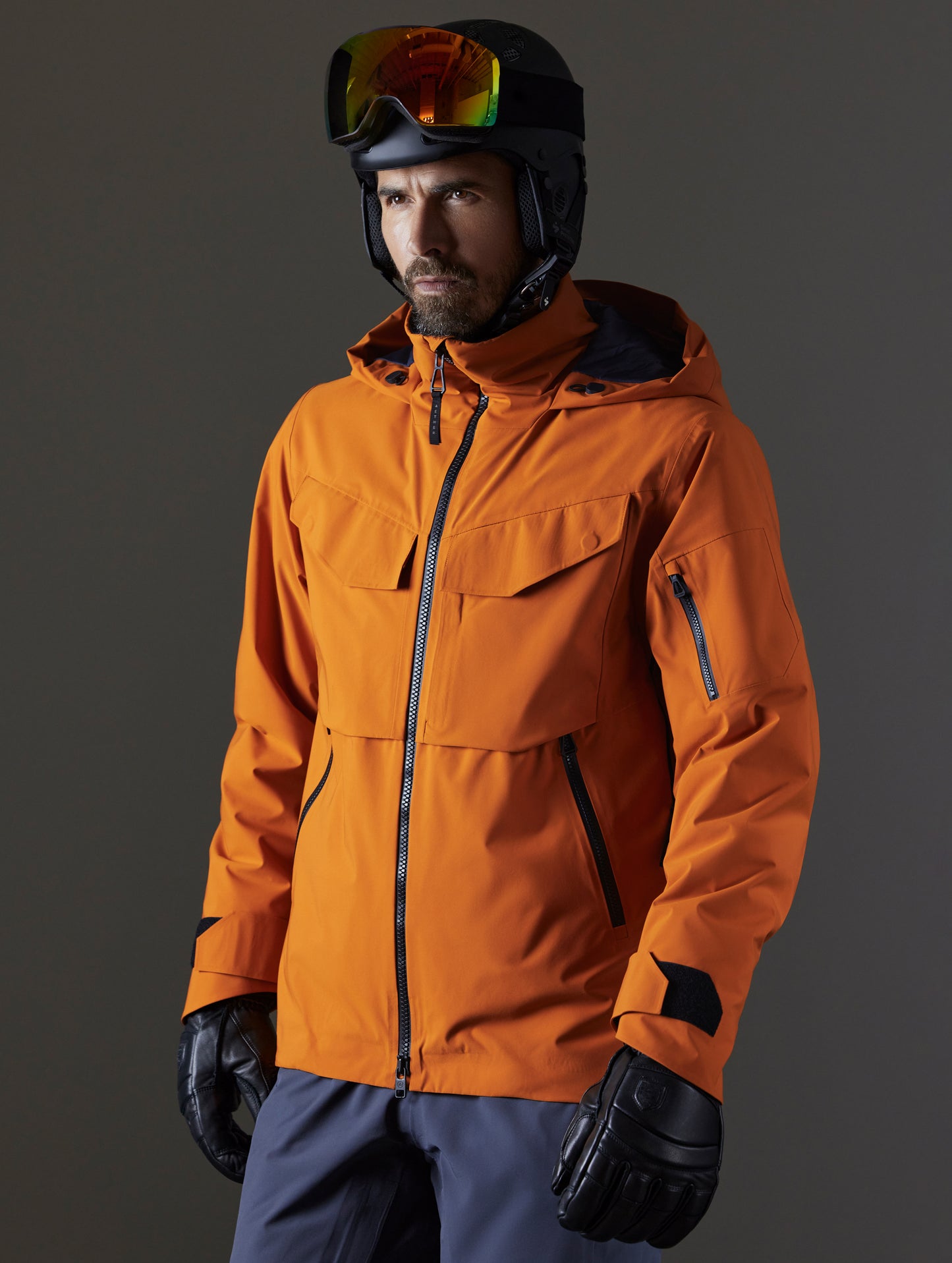 Man wearing orange snow jacket from AETHER Apparel