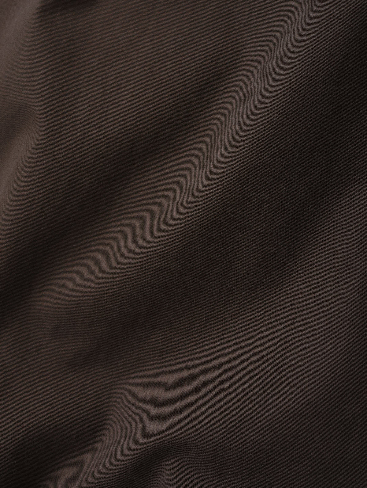 Closeup detailed view of the combed cotton construction on the Caden Work Shirt in Ash Brown from AETHER Apparel.