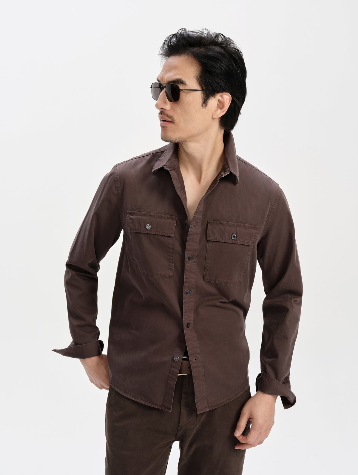 Front upper-body view of man wearing the Caden Work Shirt in Ash Brown from AETHER Apparel.