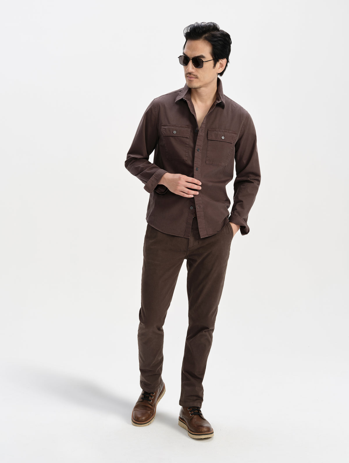 Front full-body view of man wearing the Caden Work Shirt in Ash Brown from AETHER Apparel.