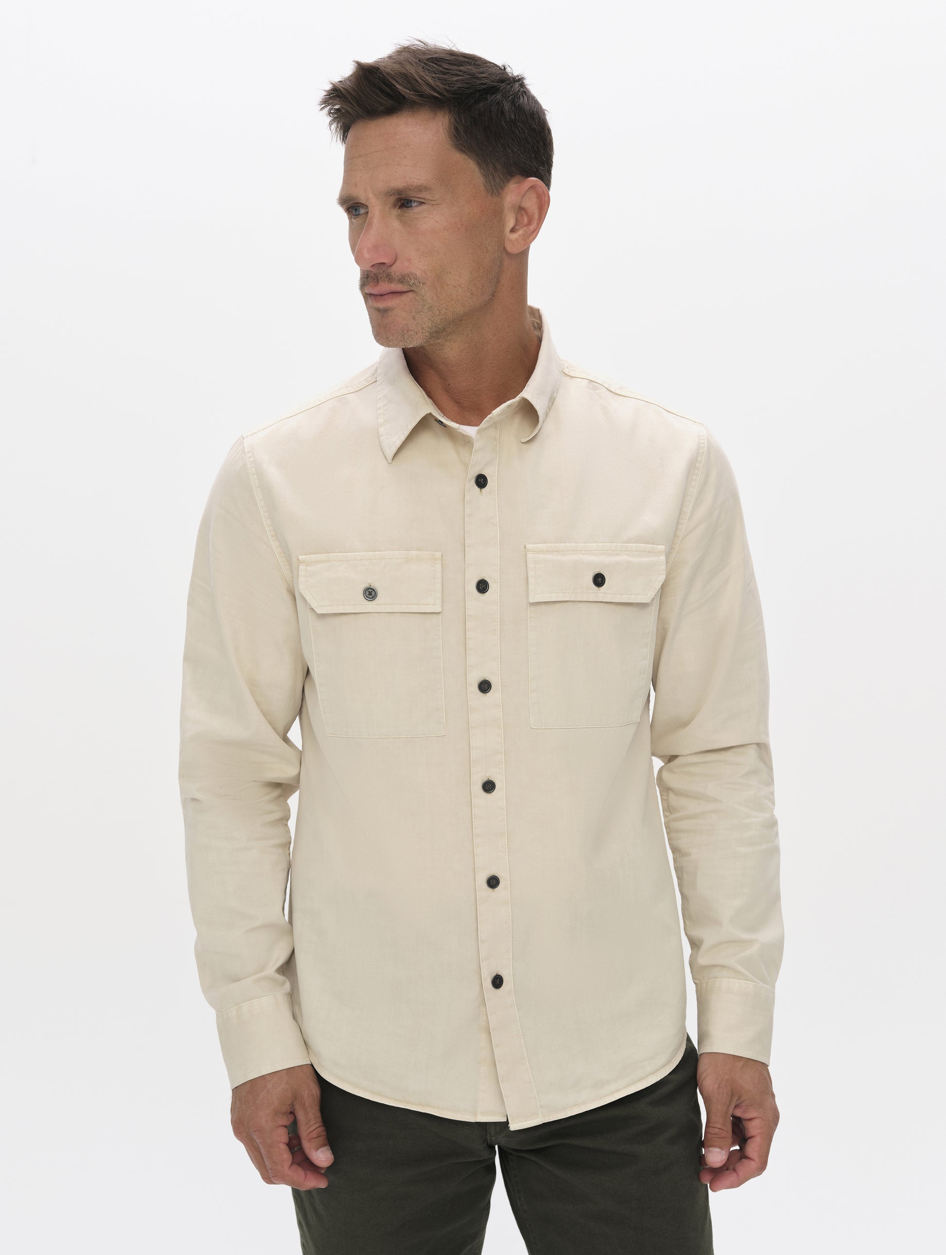 Front upper-body view of man wearing the Caden Work Shirt in Bone from AETHER Apparel.