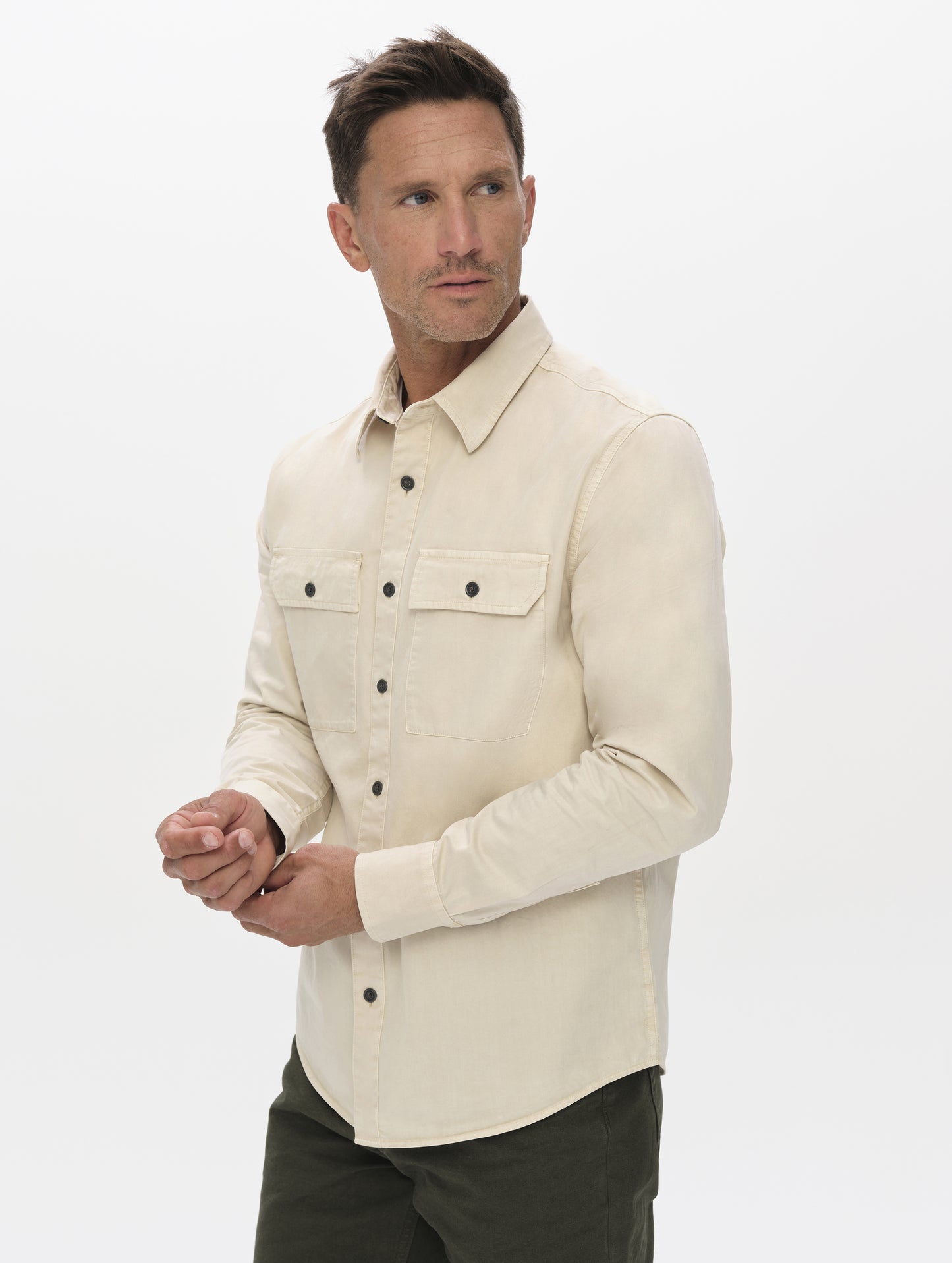 Front angled upper-body view of man wearing the Caden Work Shirt in Bone from AETHER Apparel.