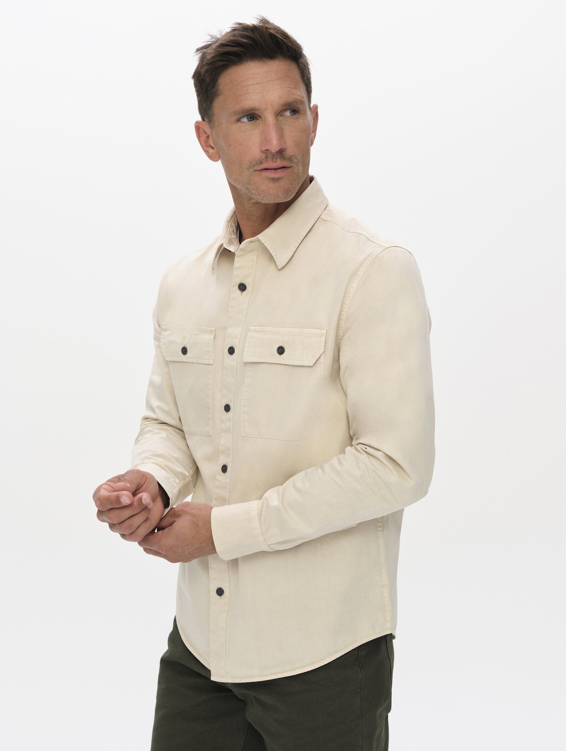 Front angled upper-body view of man wearing the Caden Work Shirt in Bone from AETHER Apparel.