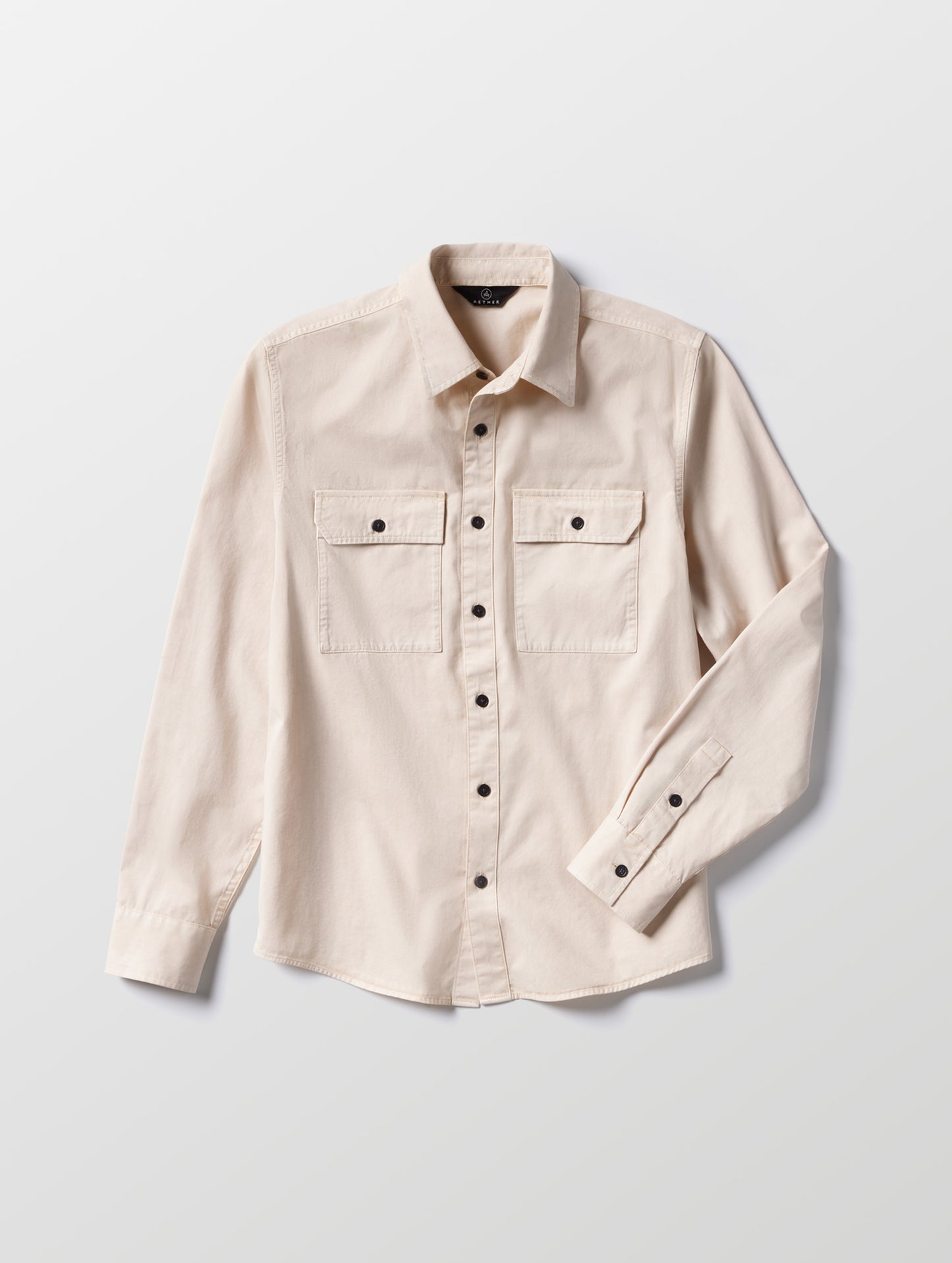 Flat lay of the Caden Work Shirt in Bone from AETHER Apparel.