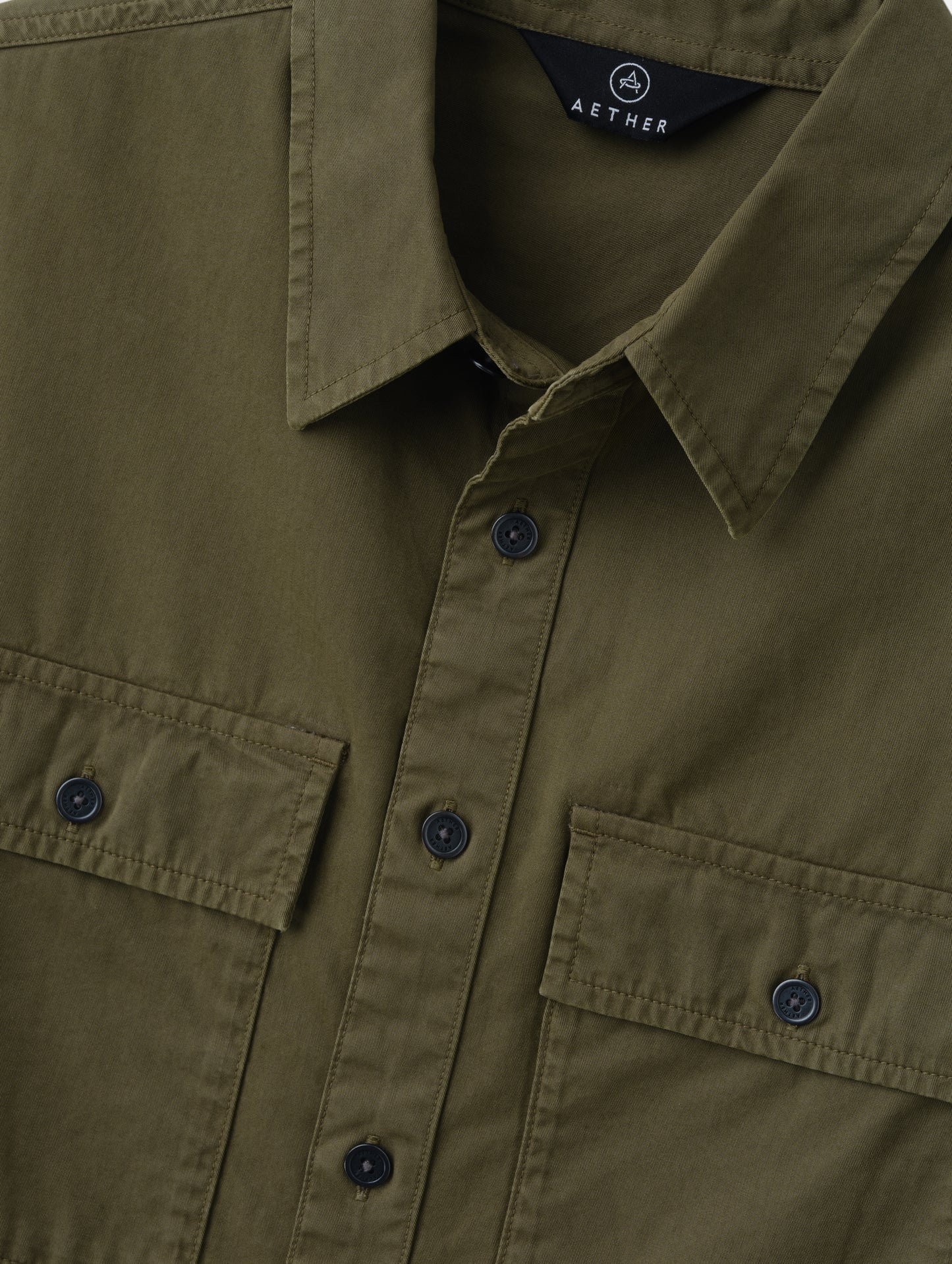 Closeup detailed view of the main center-front button closure and collar on the Caden Work Shirt in Cadet from AETHER Apparel.