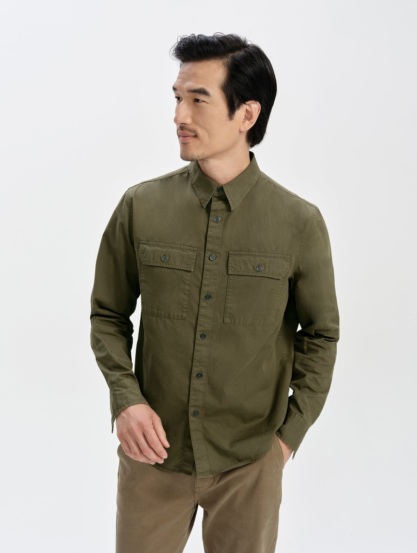 Front upper-body view of man wearing the Caden Work Shirt in Cadet from AETHER Apparel.