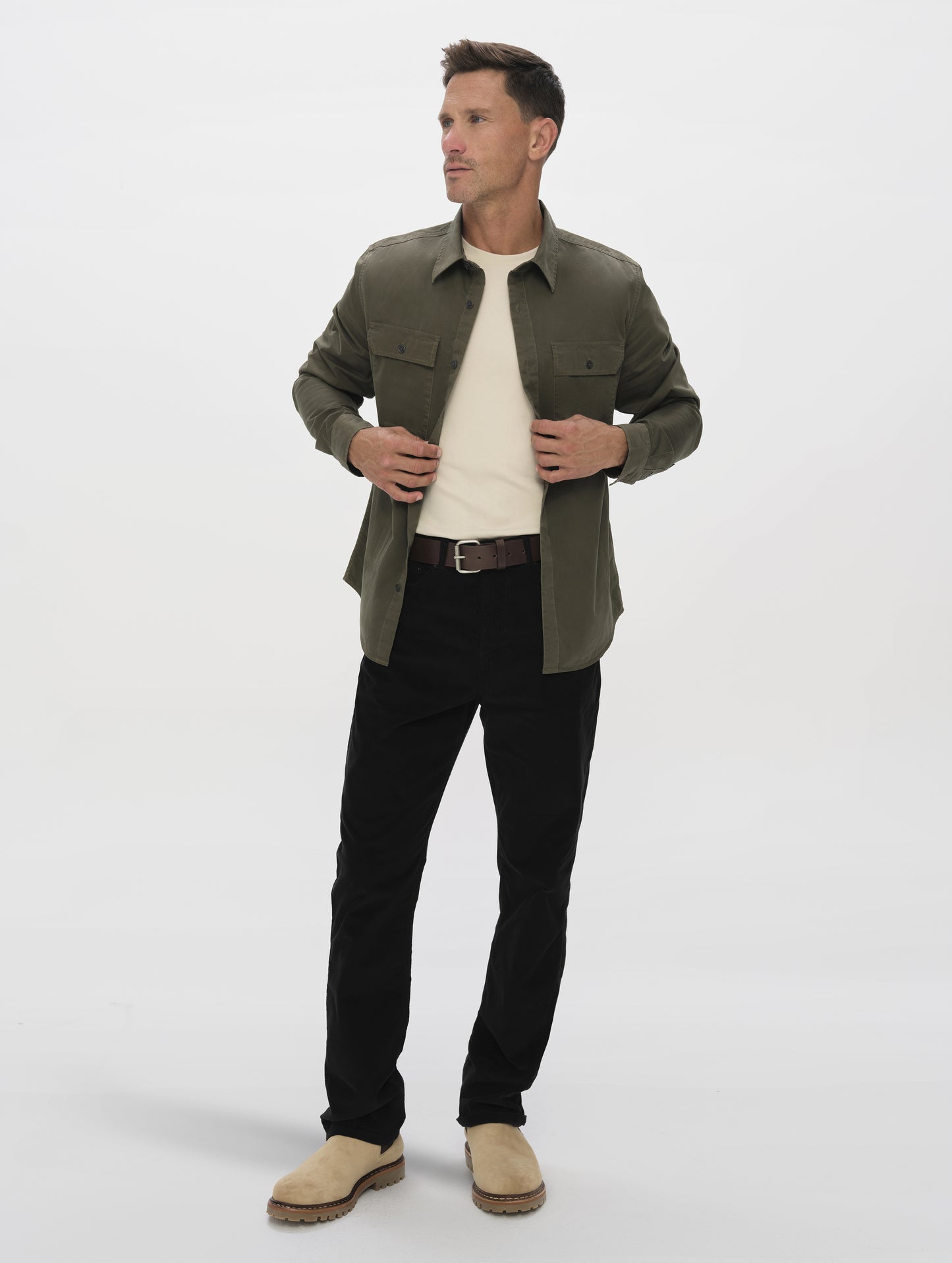 Front full-body view of man wearing the Caden Work Shirt in Forest Green from AETHER Apparel.