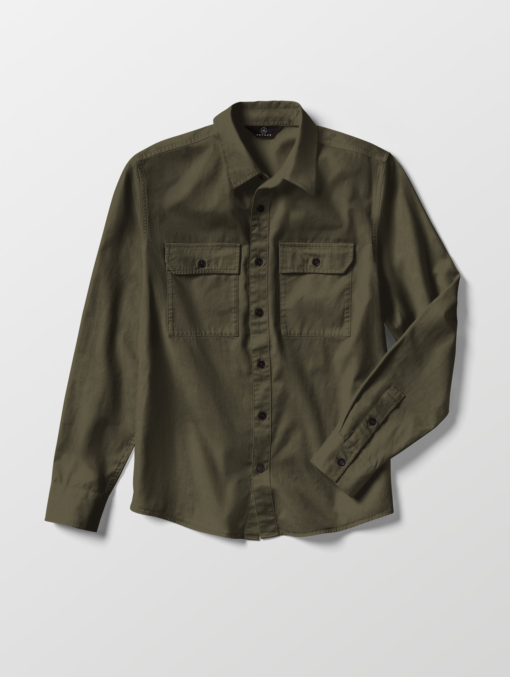 Flat lay of the Caden Work Shirt in Forest Green from AETHER Apparel.