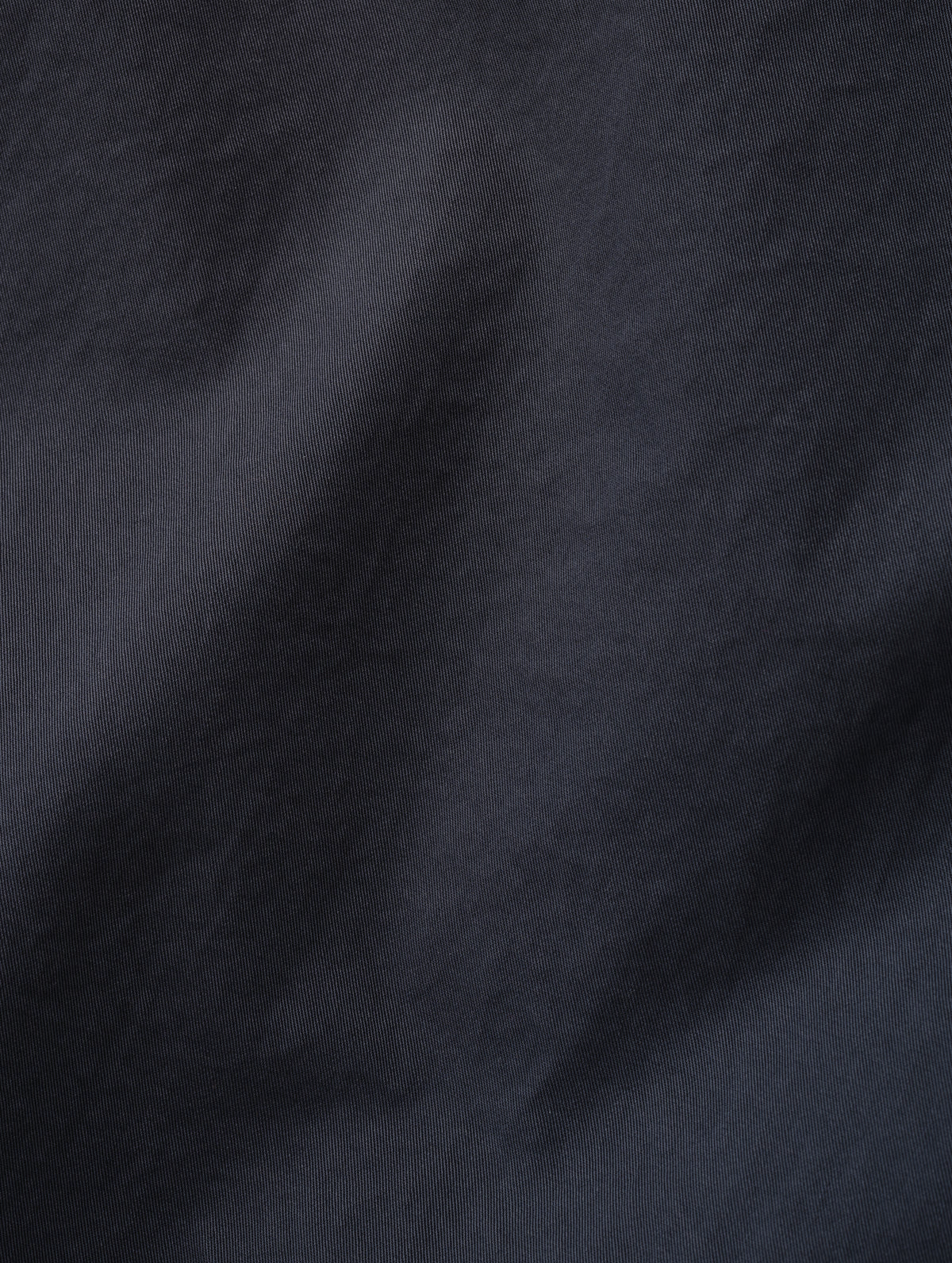 Closeup detailed view of the combed cotton construction on the Caden Work Shirt in Graphite from AETHER Apparel.