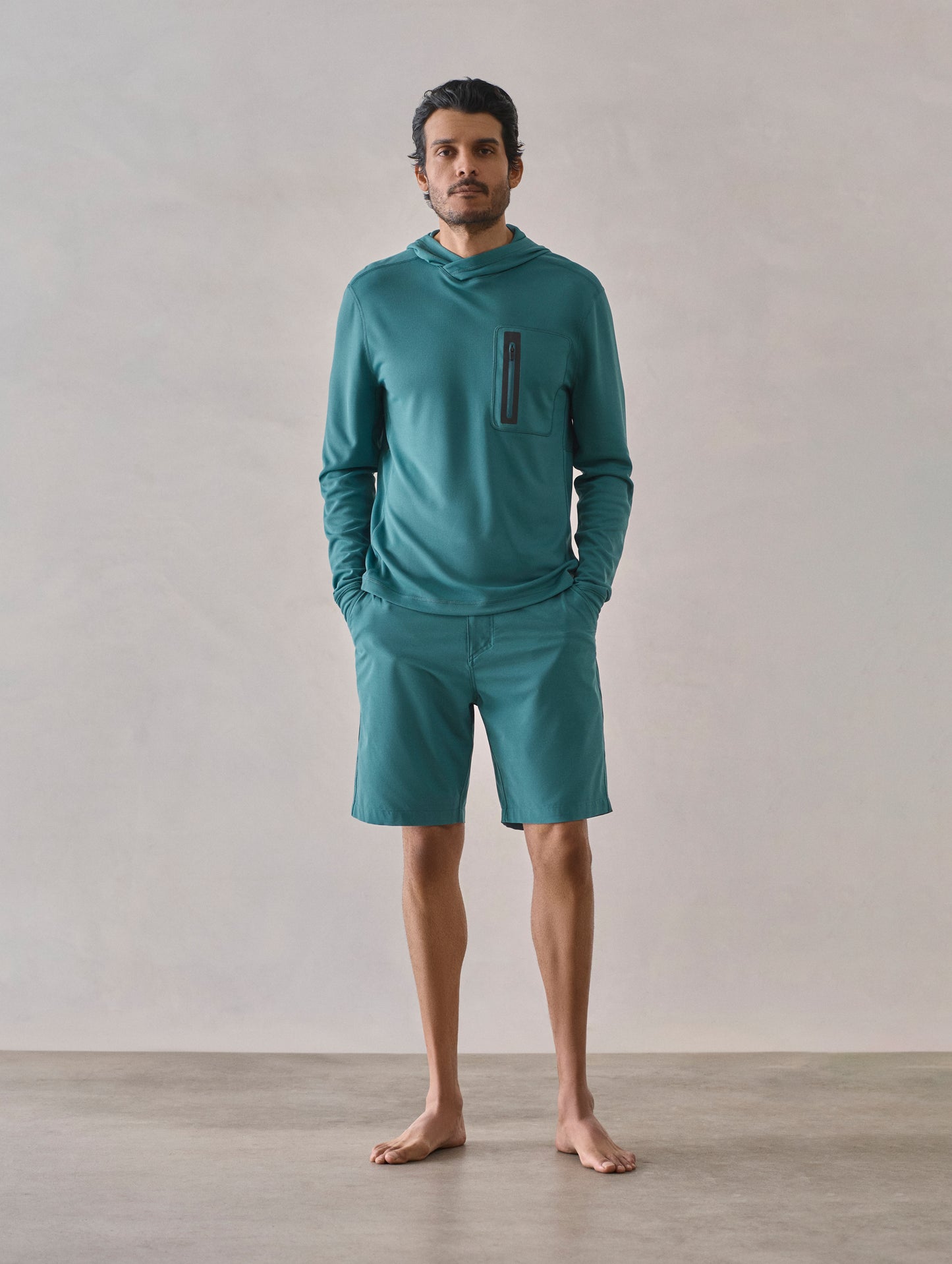 Front full-body view of man wearing Catalina Submersible Short in Aqua Blue from AETHER Apparel.