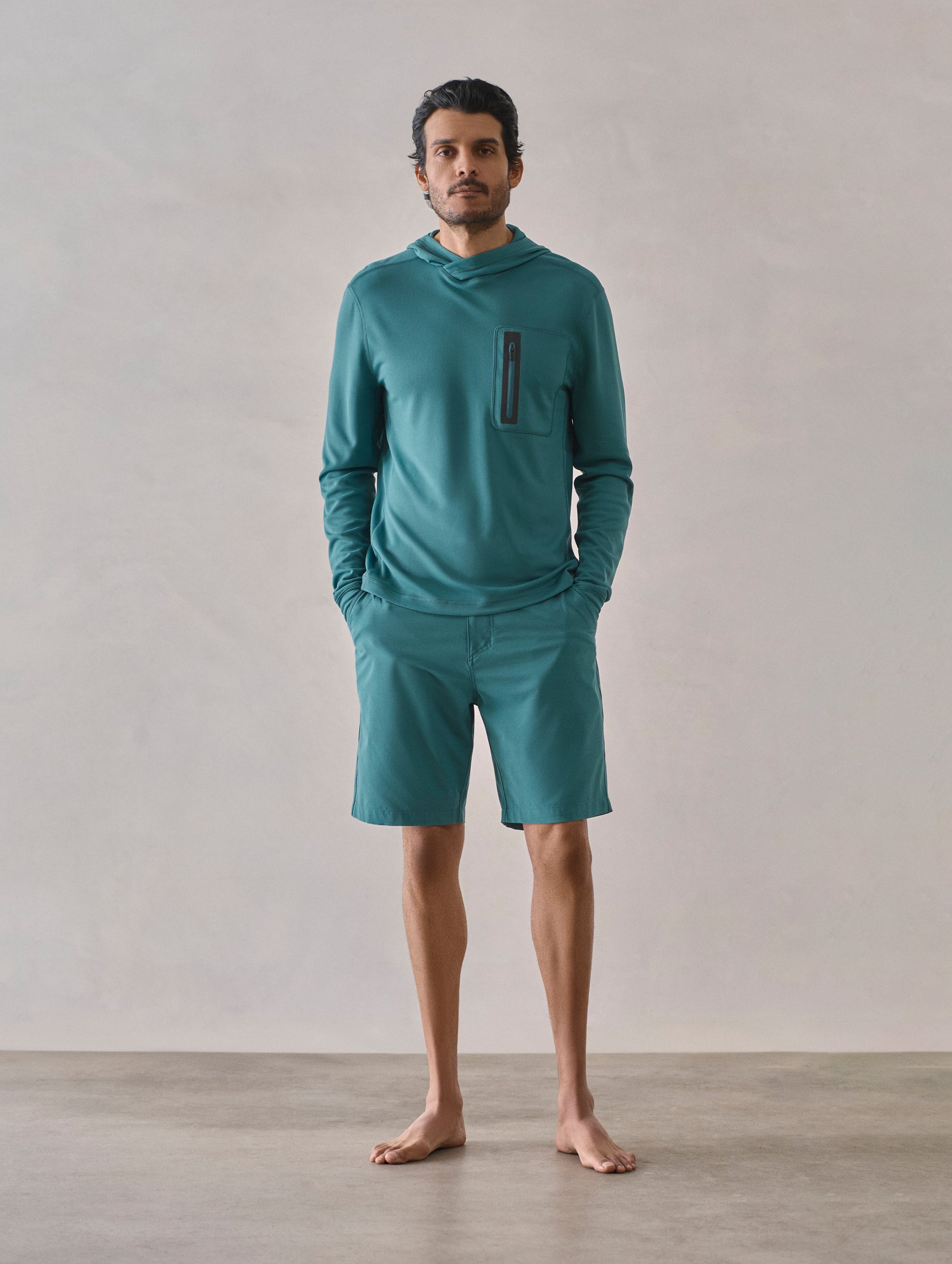 Front full-body view of man wearing Catalina Submersible Short in Aqua Blue from AETHER Apparel.
