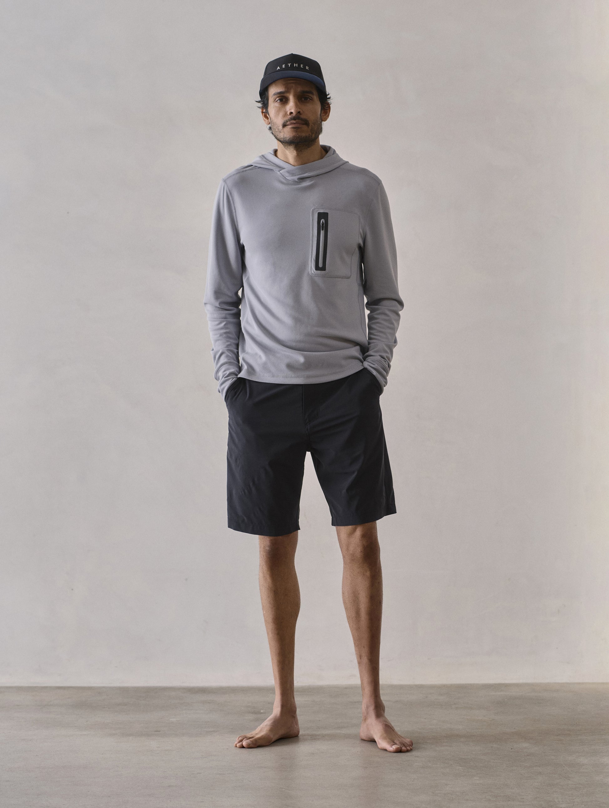 Front full-body view of man wearing Catalina Submersible Short in Onyx Black from AETHER Apparel.
