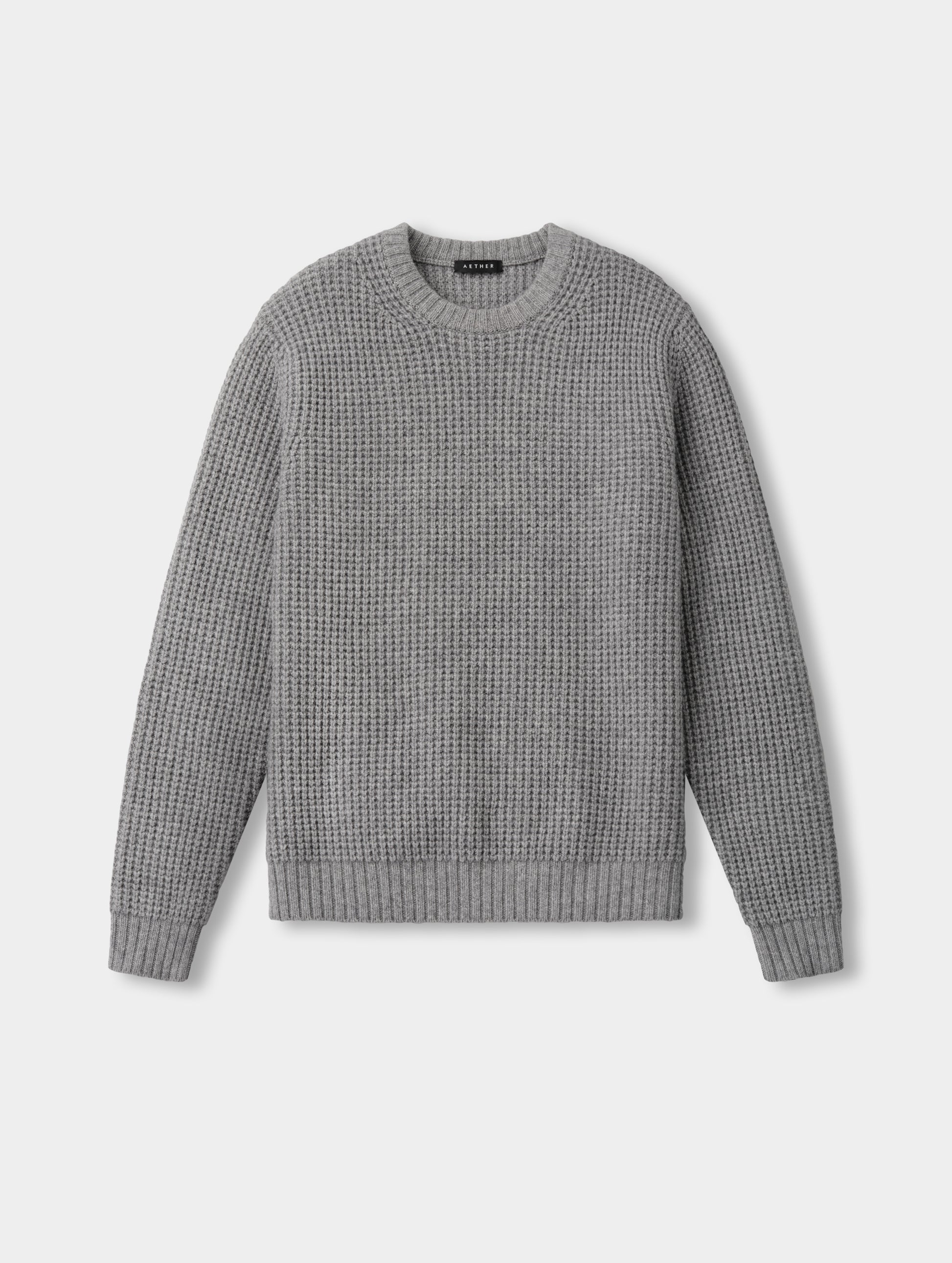 Flat lay of the Coastal Waffle Sweater in Heather Grey from AETHER Apparel.