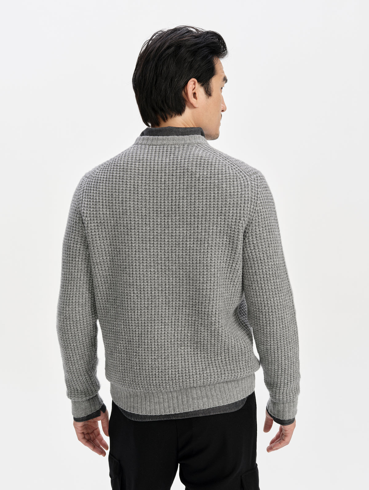 Rear upper-body view of man wearing the Coastal Waffle Sweater in Heather Grey from AETHER Apparel.