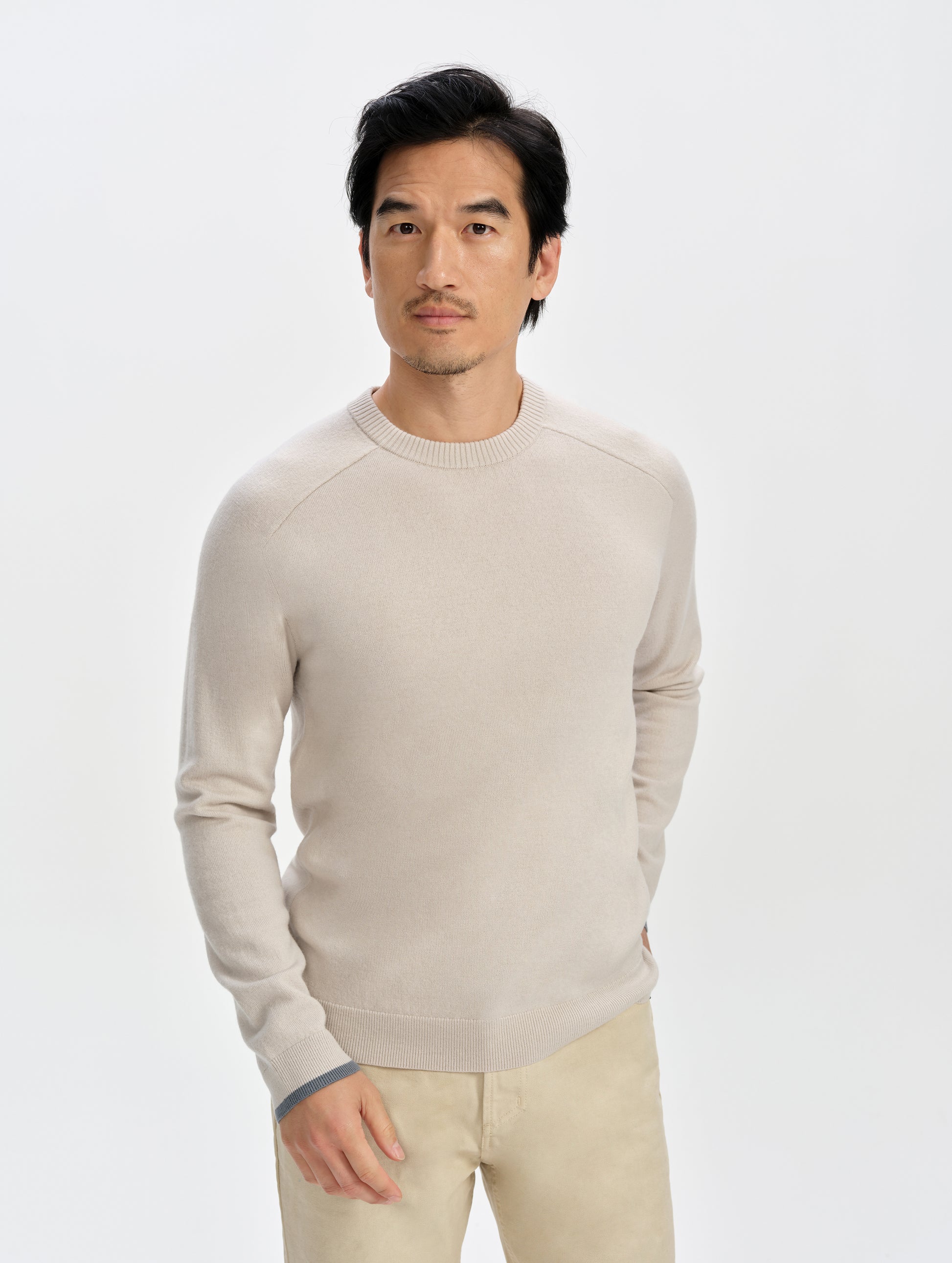 Front upper-body view of man wearing the Corbin Sweater in Bone from AETHER Apparel.