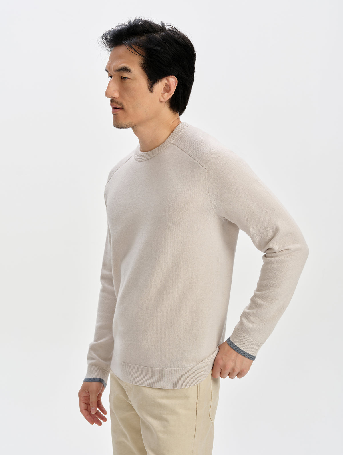 Front 3/4 upper-body view of man wearing the Corbin Sweater in Bone from AETHER Apparel.