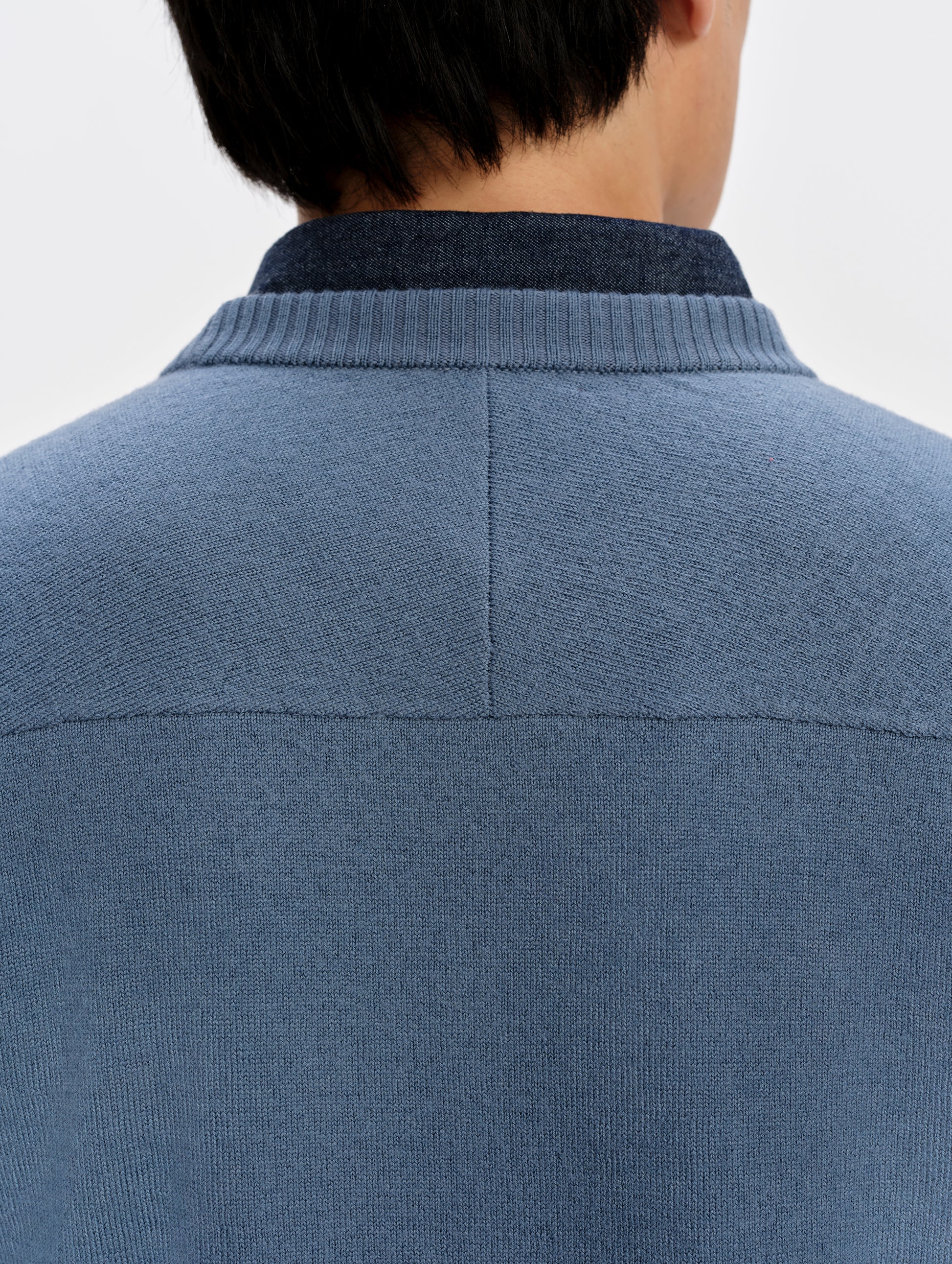 Closeup detailed view of the center back and yoke seams on the Corbin Sweater in Portal Blue from AETHER Apparel.